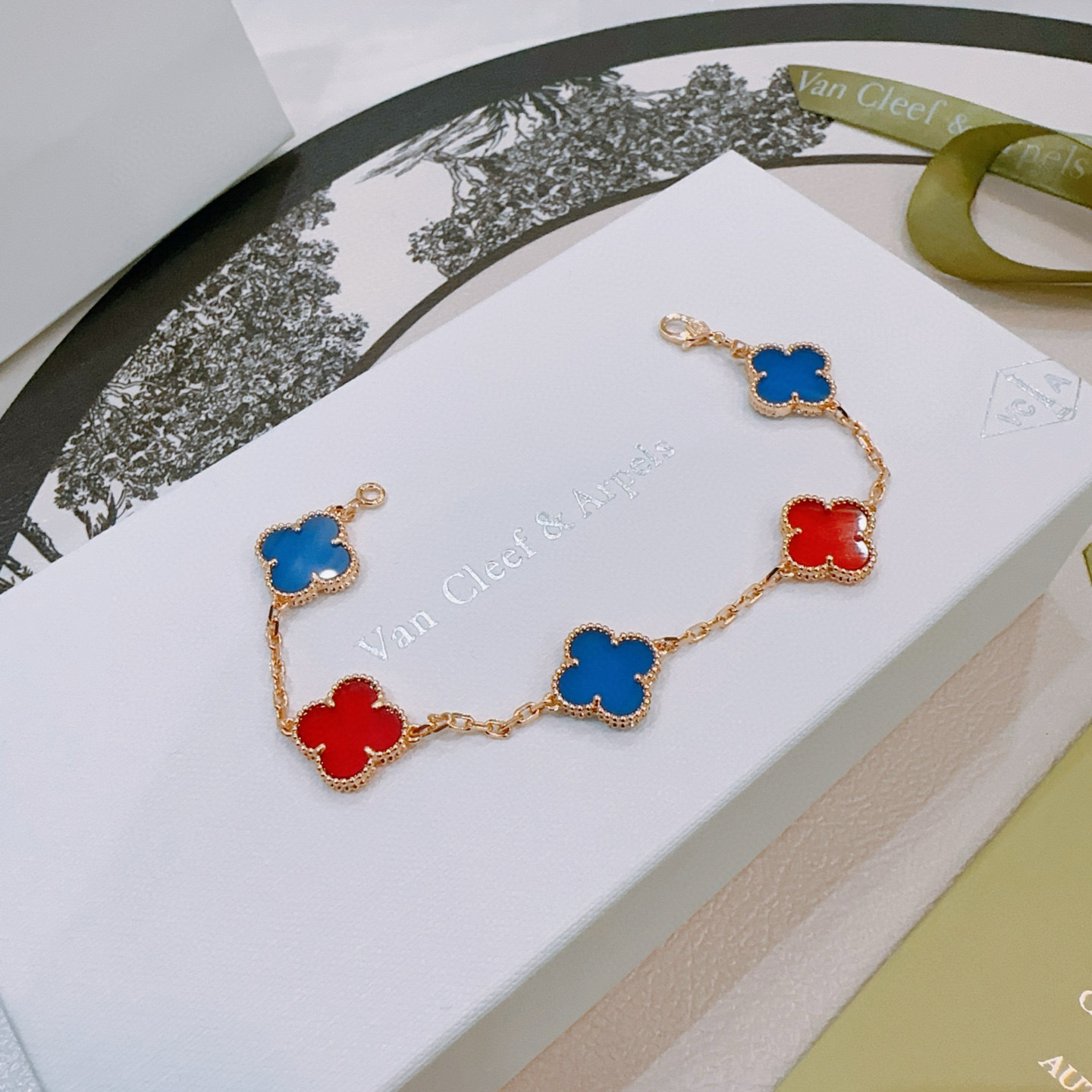Van Cleef Arpels Alhambra bracelet Gold-toned metal with blue and red clover inlays 17cm