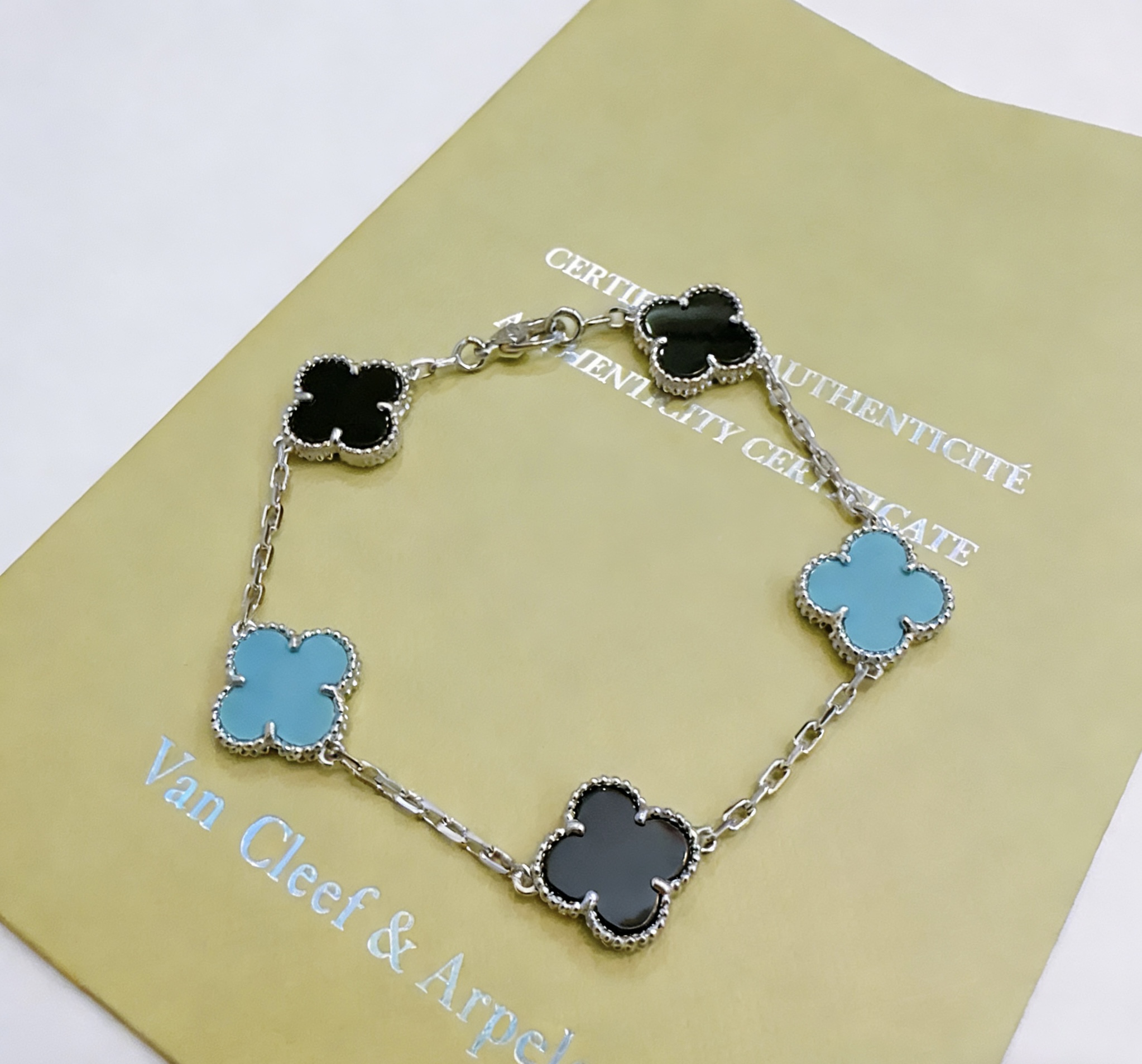 Van Cleef Arpels Alhambra bracelet Silver-toned metal with black onyx and turquoise blue clover inlays 18cm