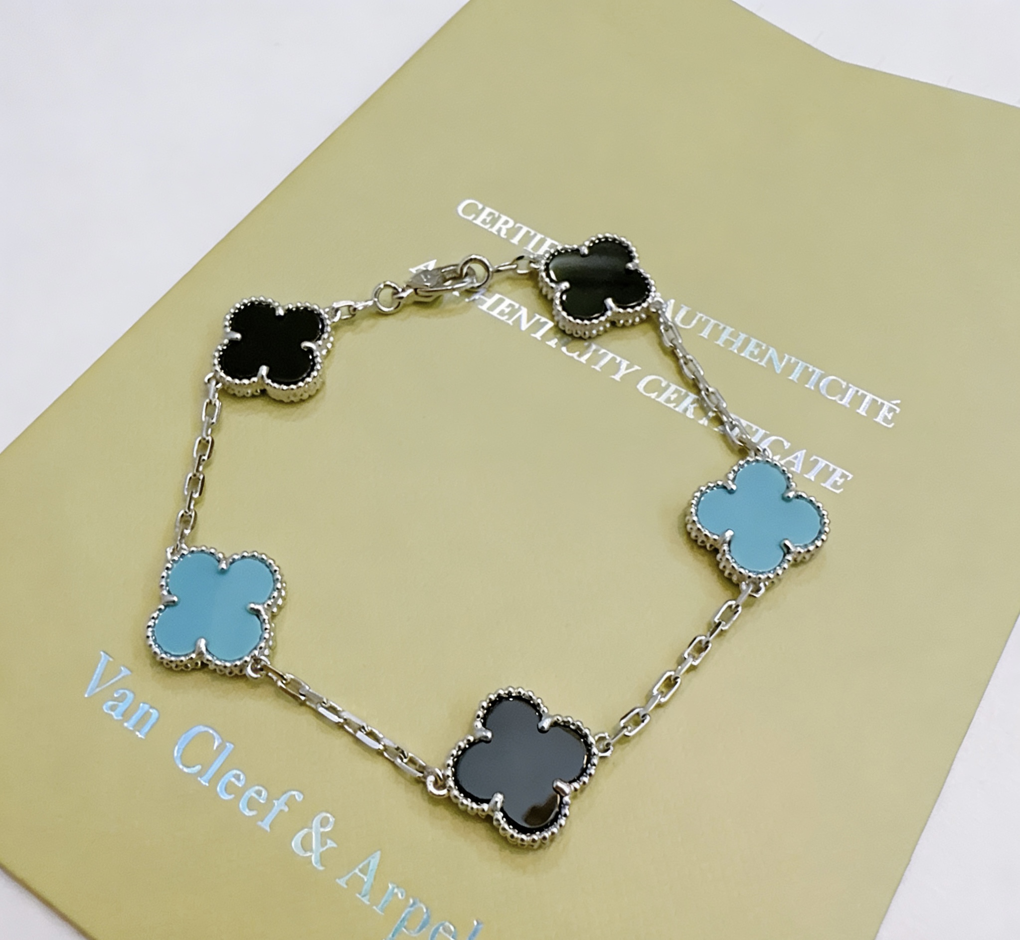 Van Cleef Arpels Alhambra bracelet Silver-toned metal with black onyx and turquoise blue clover inlays 18cm