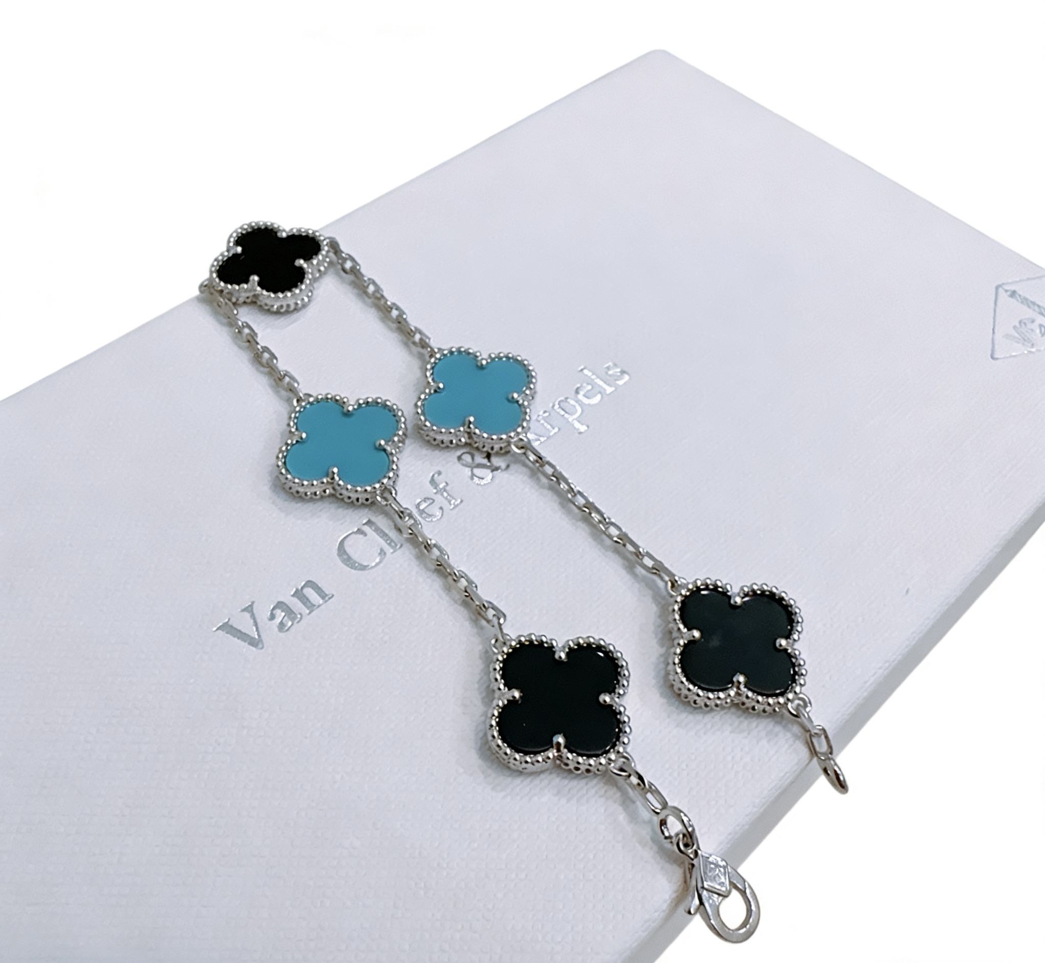 Van Cleef Arpels Alhambra bracelet Silver-toned metal with black onyx and turquoise blue clover inlays 18cm