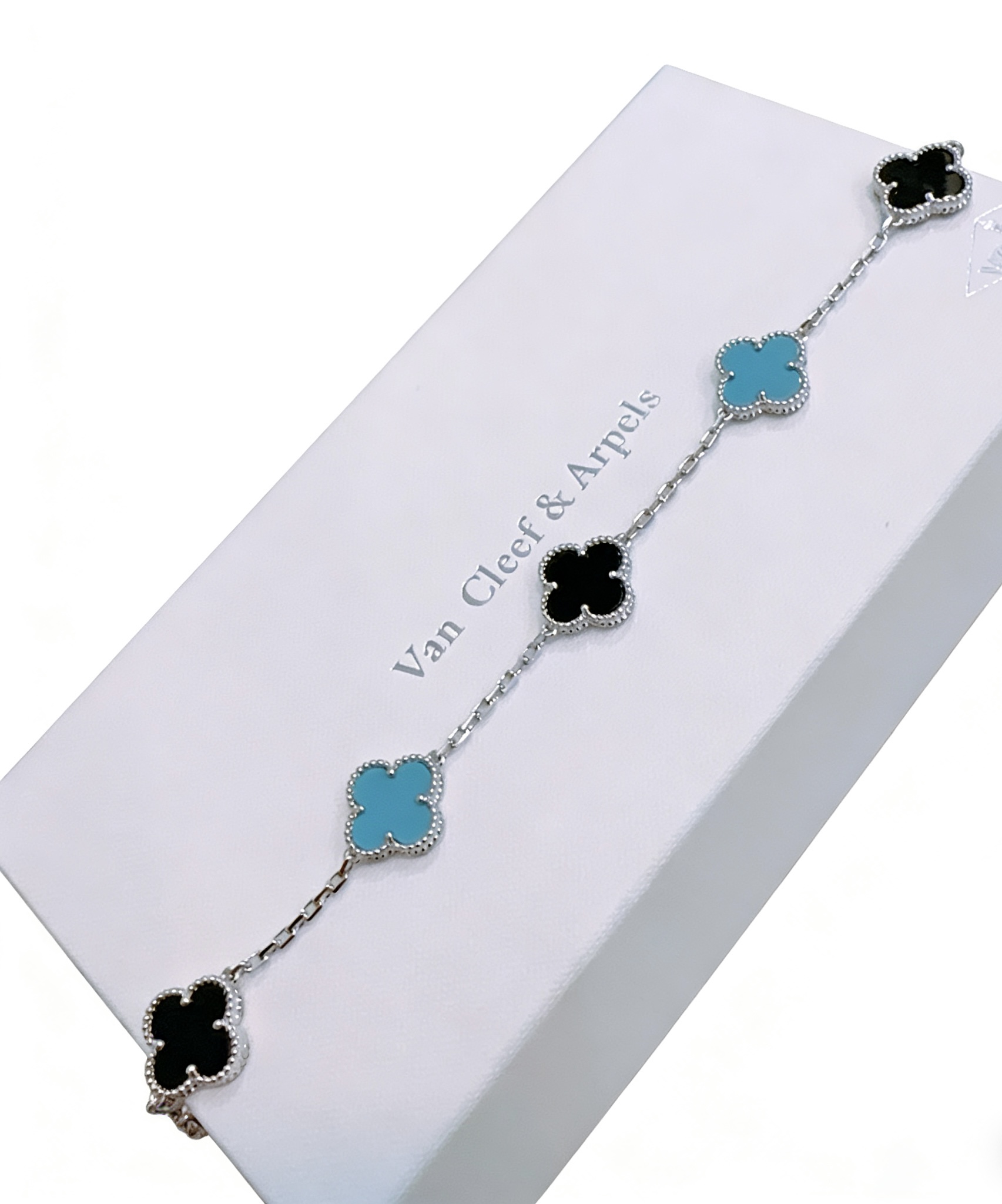 Van Cleef Arpels Alhambra bracelet Silver-toned metal with black onyx and turquoise blue clover inlays 18cm