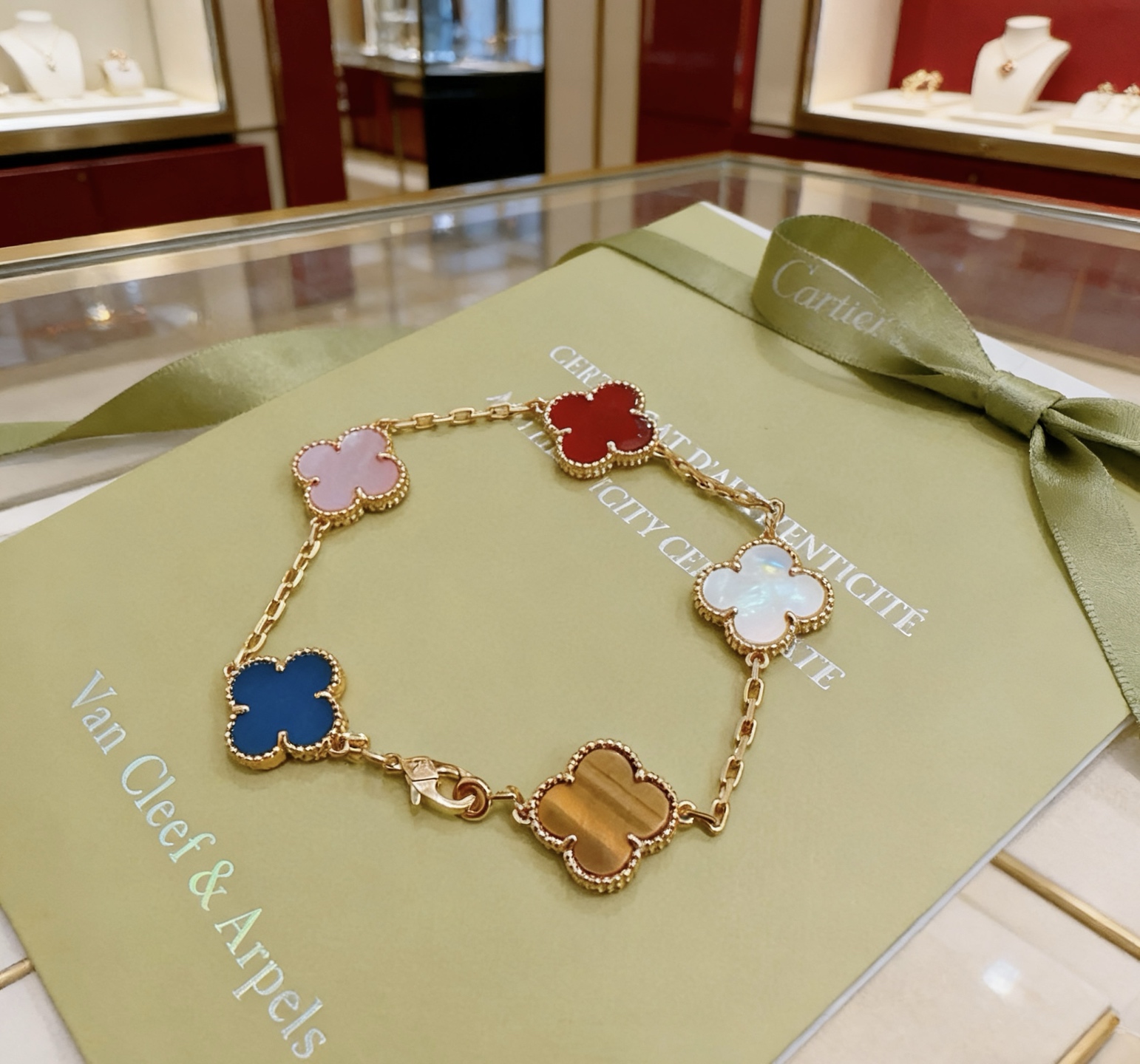Van Cleef Arpels Alhambra bracelet Yellow gold metal with blue agate white mother-of-pearl red carnelian and tiger s eye stone clover motifs 19cm