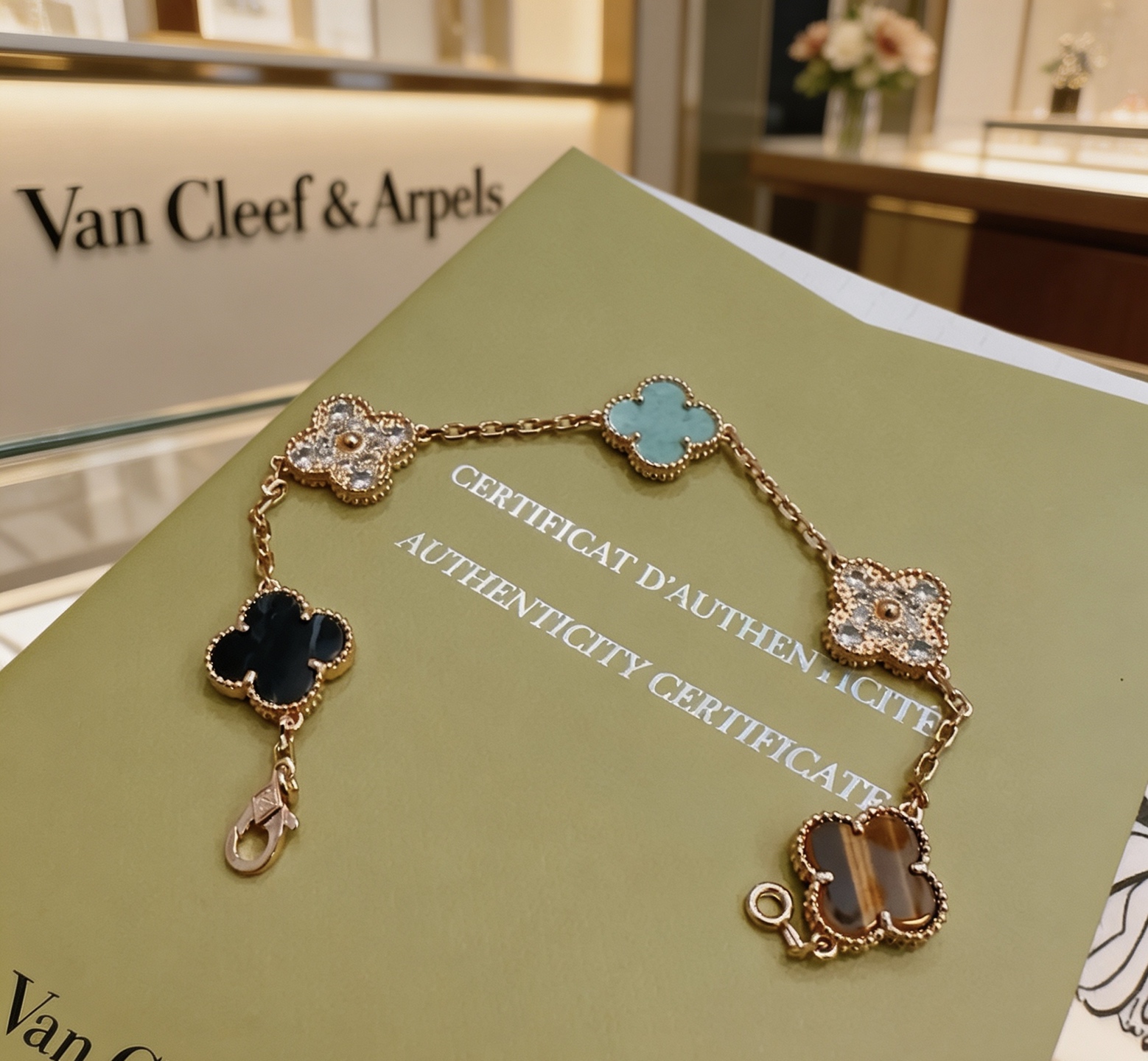 Van Cleef Arpels Alhambra bracelet Rose gold metal with turquoise diamond tiger s eye and dark blue stone accents 17cm