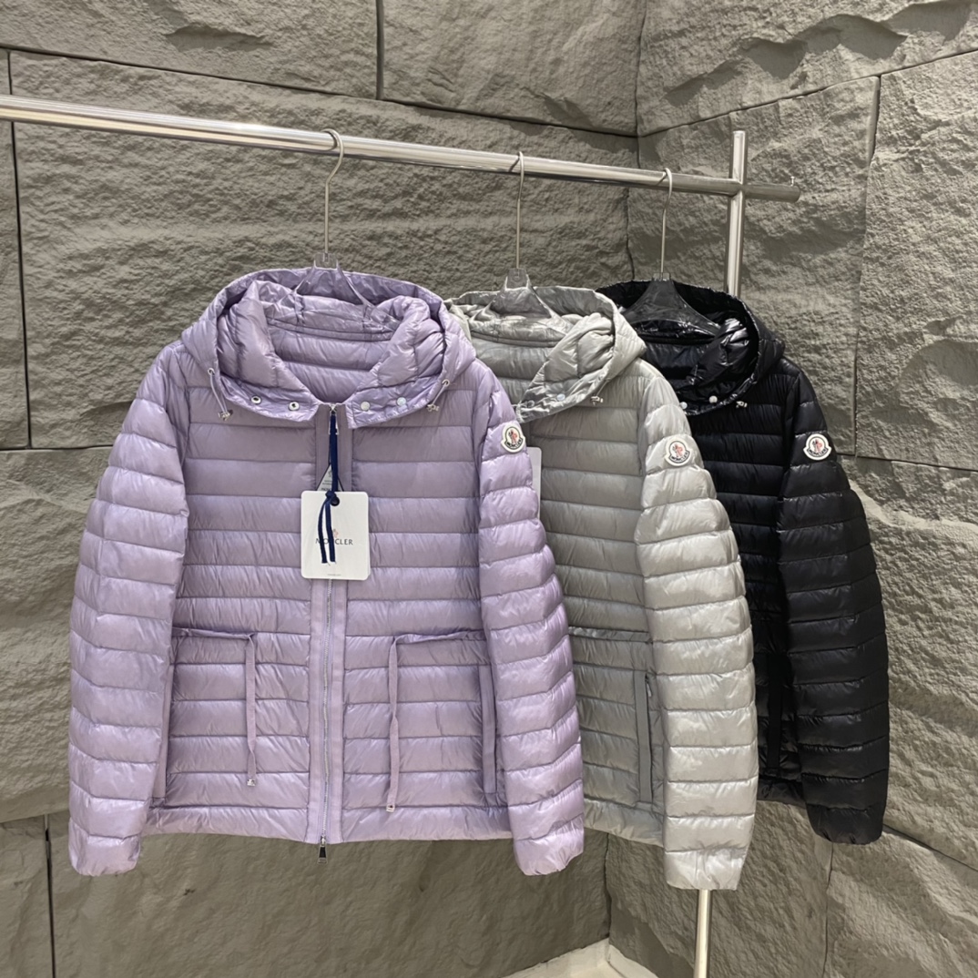 High-quality Moncler Raie short down jacket in black, gray, purple. Sizes 0-12. Streamlined design with waist drawstring, lightweight nylon quilting. Versatile style.-Big cat