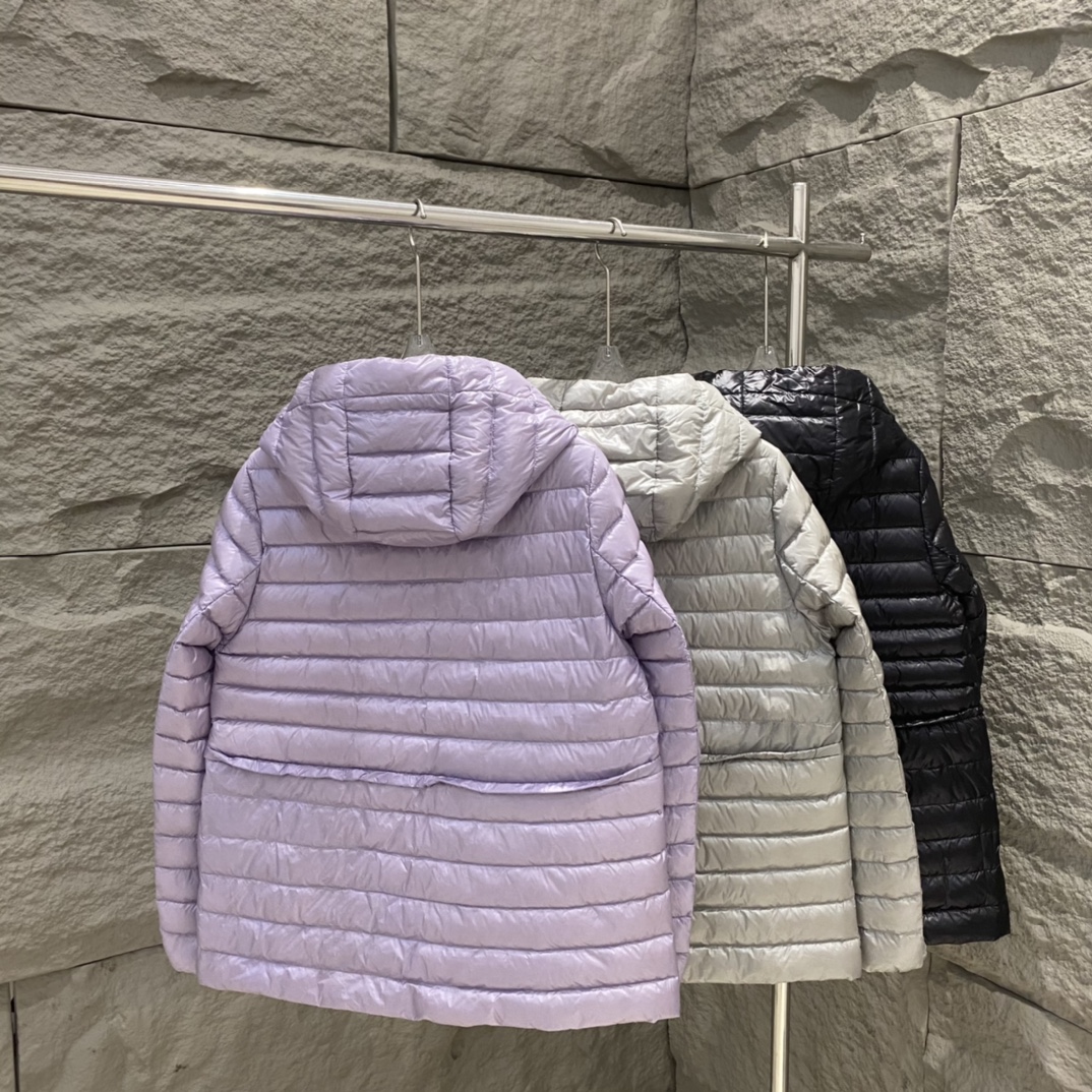 High-quality Moncler Raie short down jacket in black, gray, purple. Sizes 0-12. Streamlined design with waist drawstring, lightweight nylon quilting. Versatile style.-Big cat