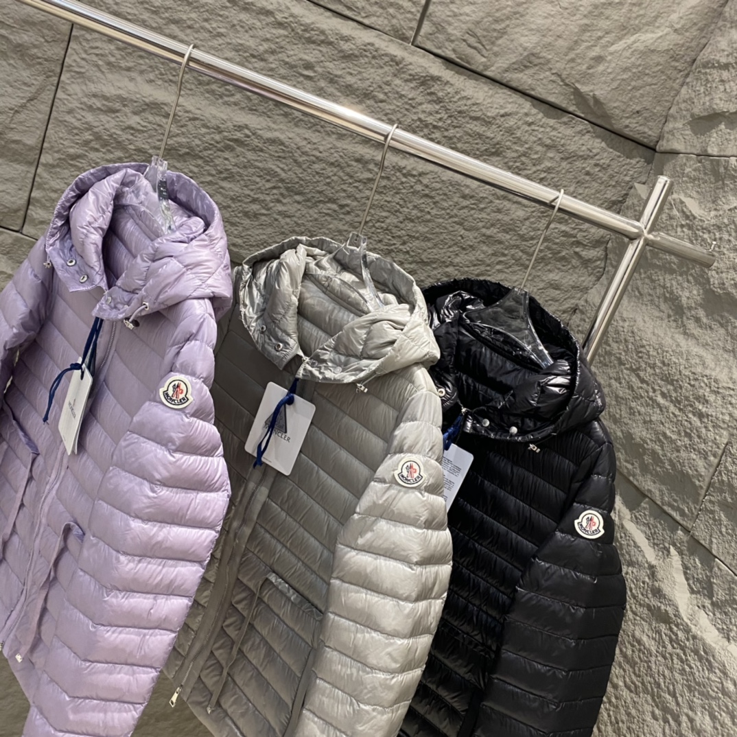 High-quality Moncler Raie short down jacket in black, gray, purple. Sizes 0-12. Streamlined design with waist drawstring, lightweight nylon quilting. Versatile style.-Big cat