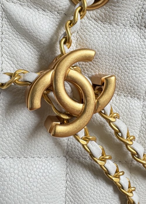 Elegant Chanel Drawstring Bucket Bag with Chain Detail - Stylish & Functional 1 Elegant Chanel Drawstring Bucket Bag with Chain Detail - Stylish & Functional