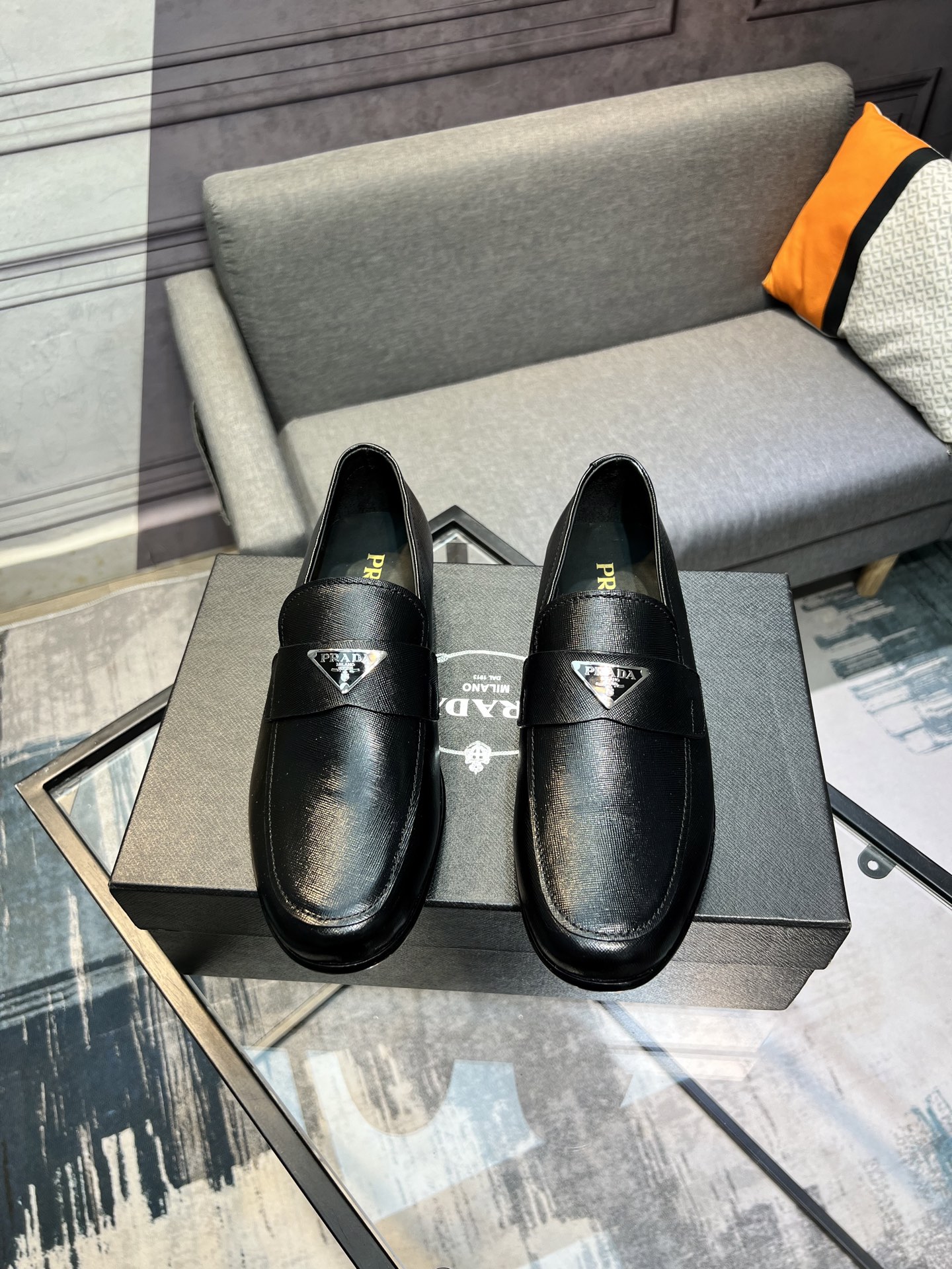 Prada Men's Polished Leather Loafers with Metal Logo | Slip-On Style 1 Prada Men's Polished Leather Loafers with Metal Logo | Slip-On Style