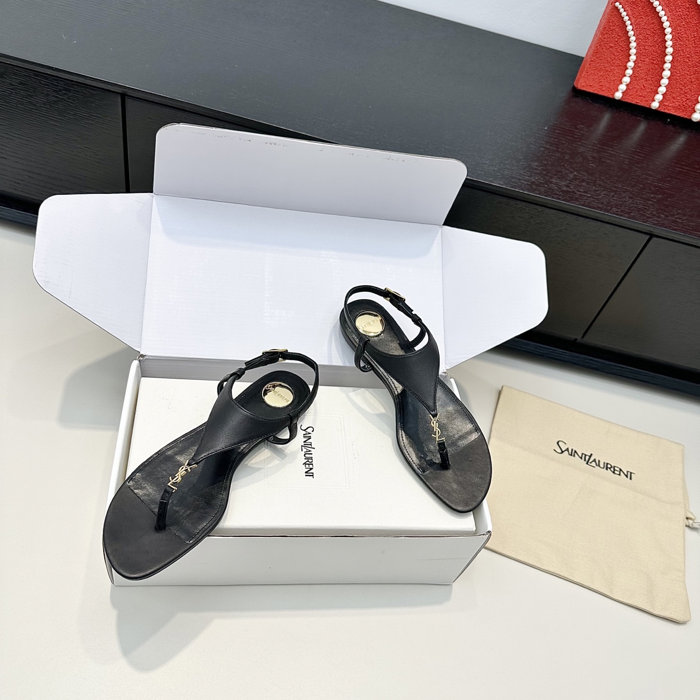 YSL Cassandra Thong Flat Sandals