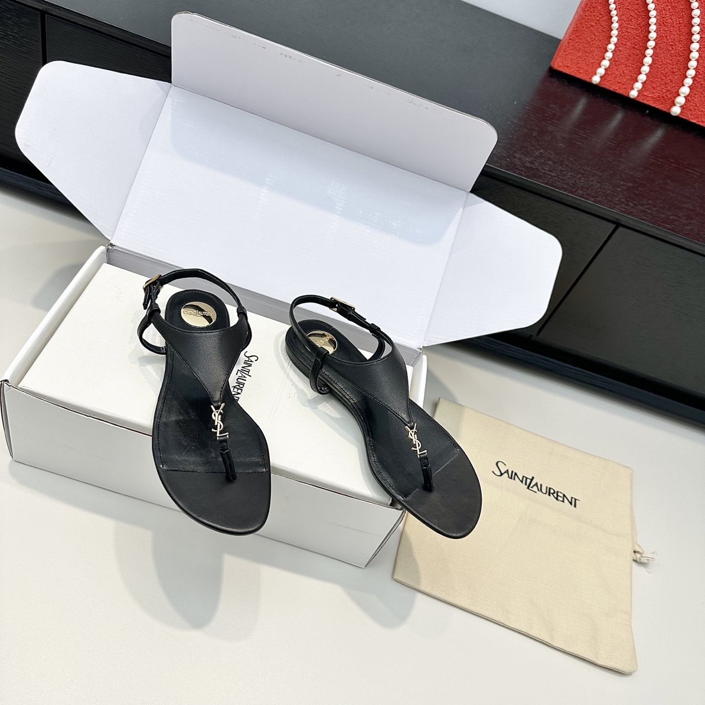 YSL Cassandra Thong Flat Sandals