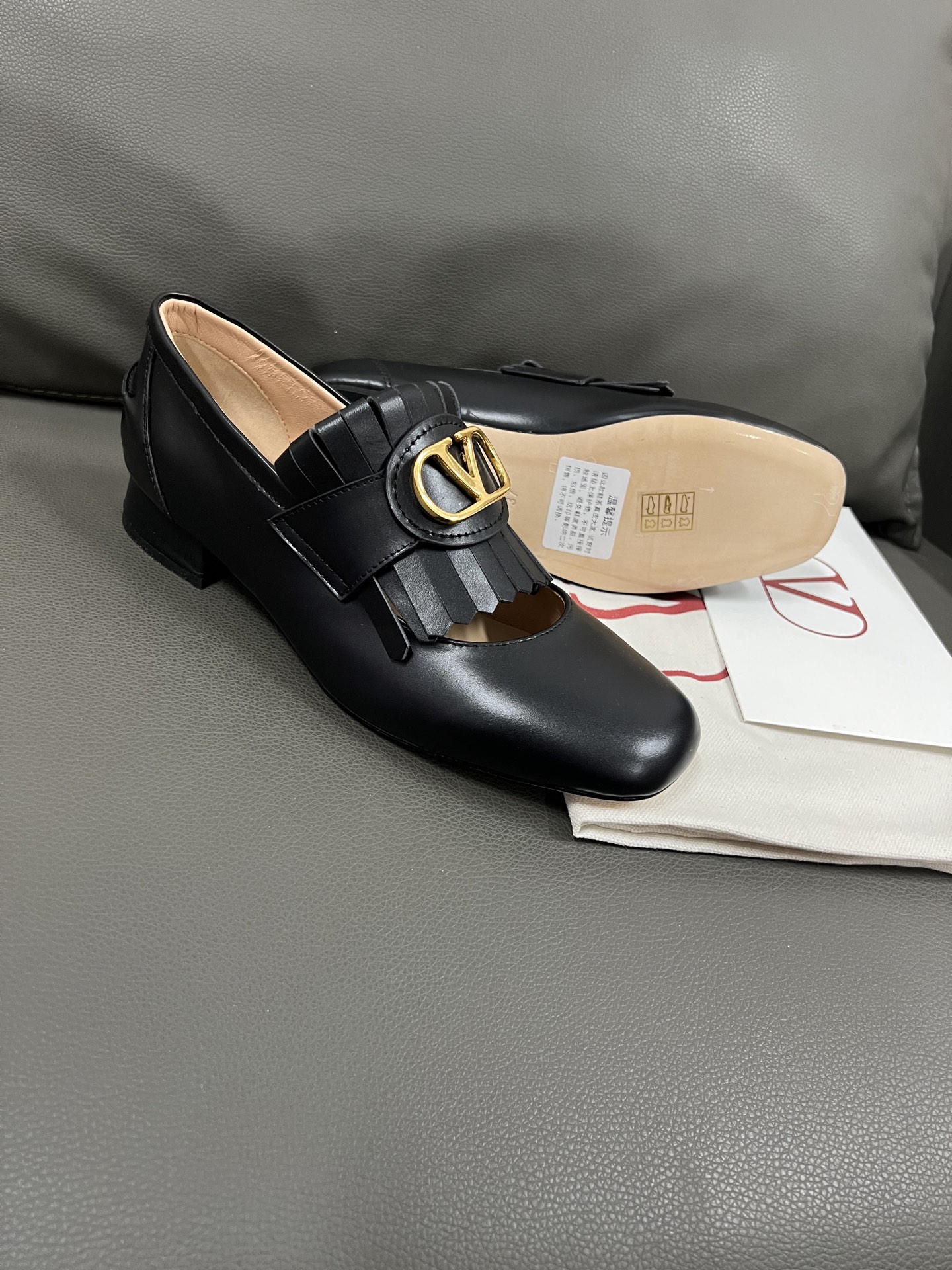 Valentino Women's Black Leather Loafers with Tassel and Gold Logo Hardware 1 Valentino Women's Black Leather Loafers with Tassel and Gold Logo Hardware