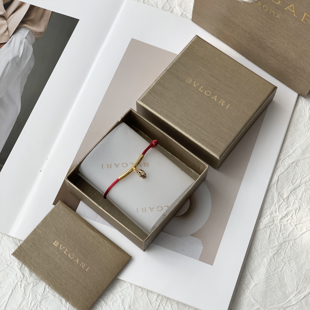 Featuring the iconic motif paired with a woven red cord, this bracelet - Jewelry 2