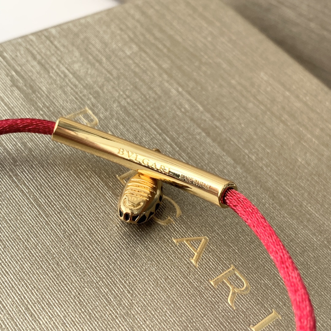 Featuring the iconic motif paired with a woven red cord, this bracelet - Jewelry 6