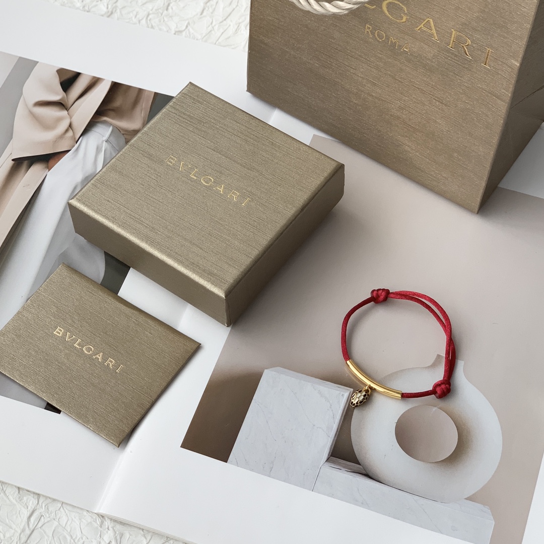 Featuring the iconic motif paired with a woven red cord, this bracelet - Jewelry 8