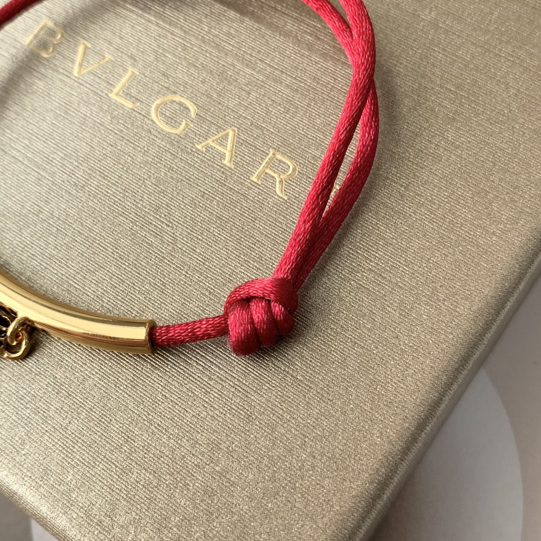 Featuring the iconic motif paired with a woven red cord, this bracelet - Jewelry 7