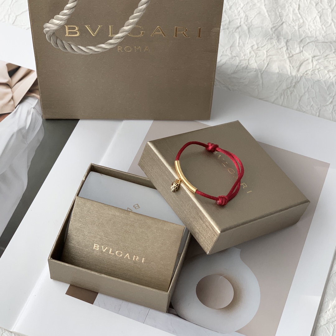 Featuring the iconic motif paired with a woven red cord, this bracelet - Jewelry 4