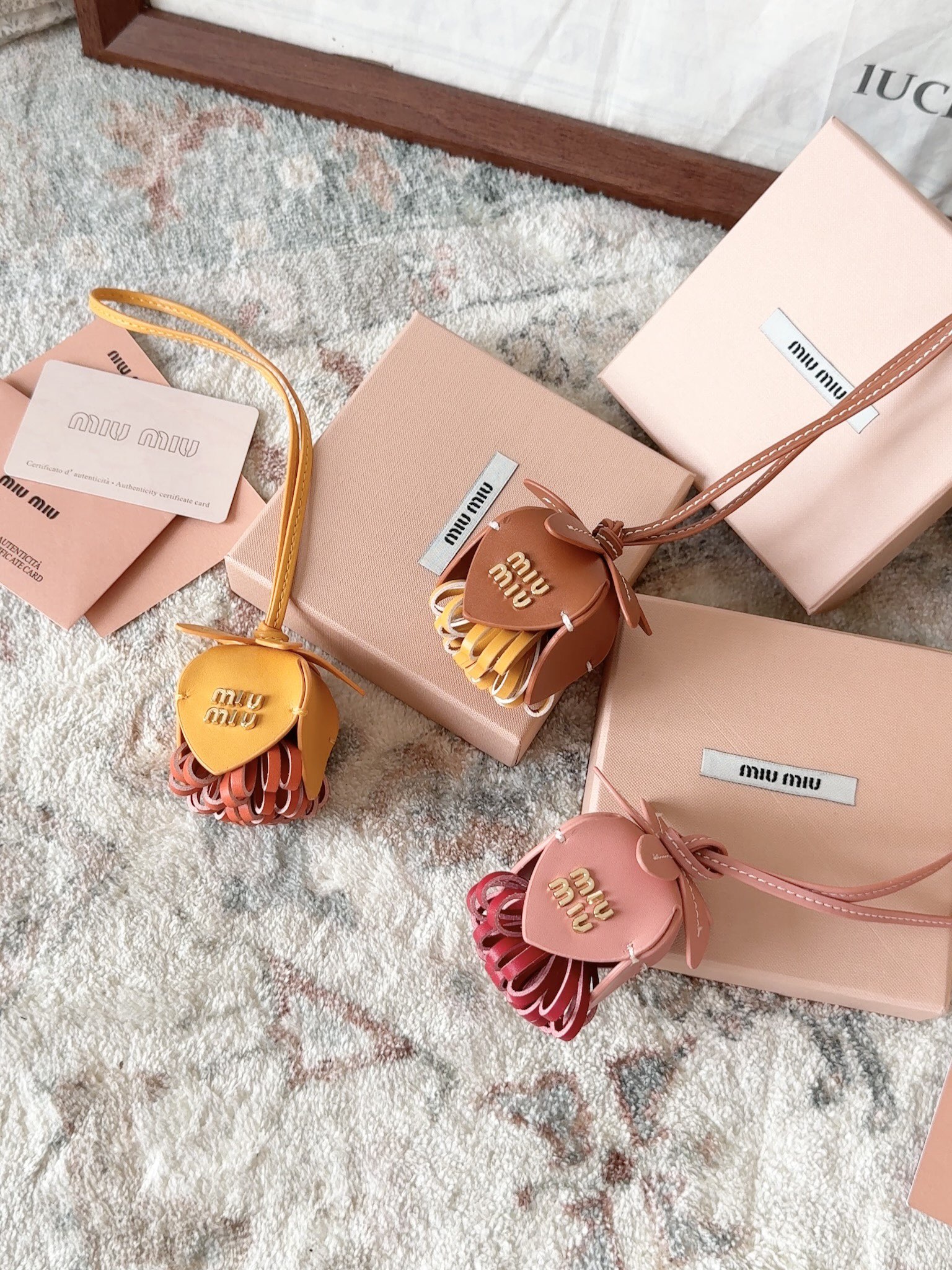 these charms serve as signature expressions of Miu Miu’s individuality - Comprehensive