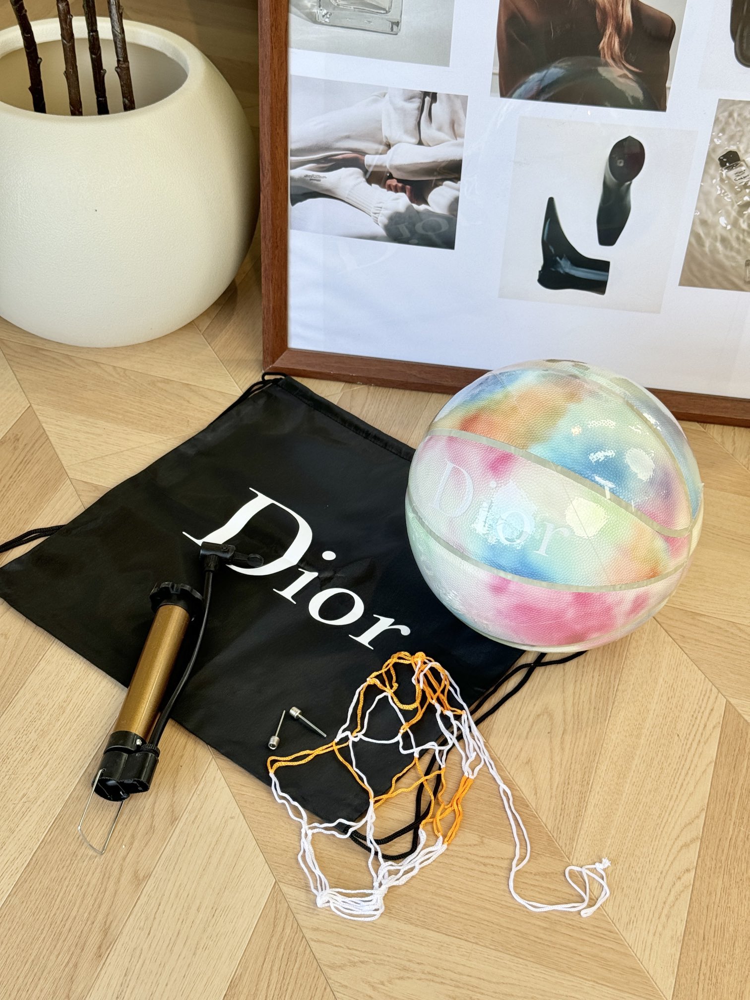 The set includes an air pump and a black fabric storage bag adorned with - Comprehensive