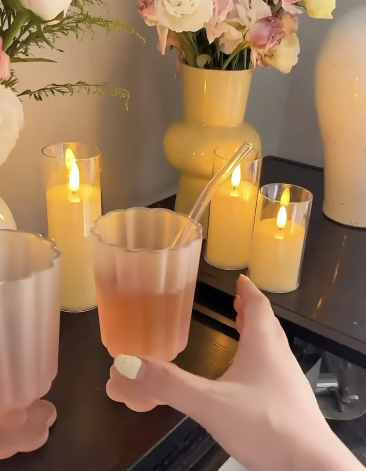 Dior cup crafted in soft pastel pink, featuring a floral-shaped base - Comprehensive