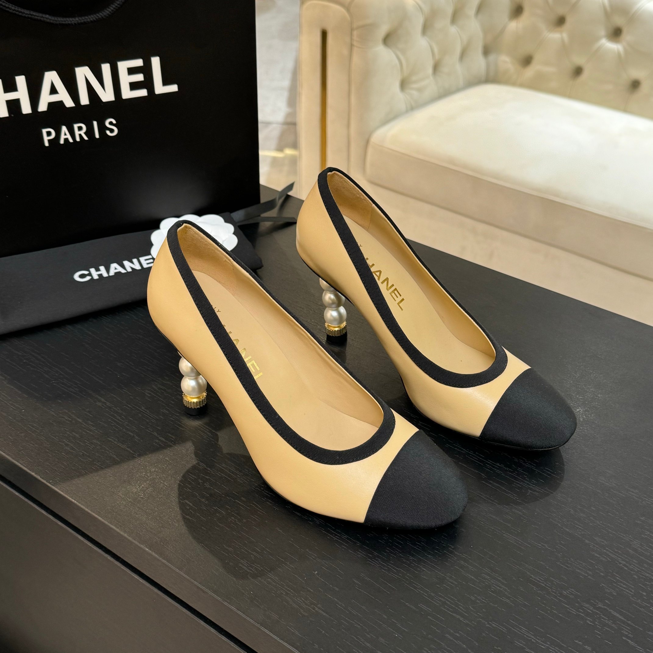 Chanel Women's Beige & Black Leather Pointed Toe Pearl Heel Pumps 5 a1745832512881 6334