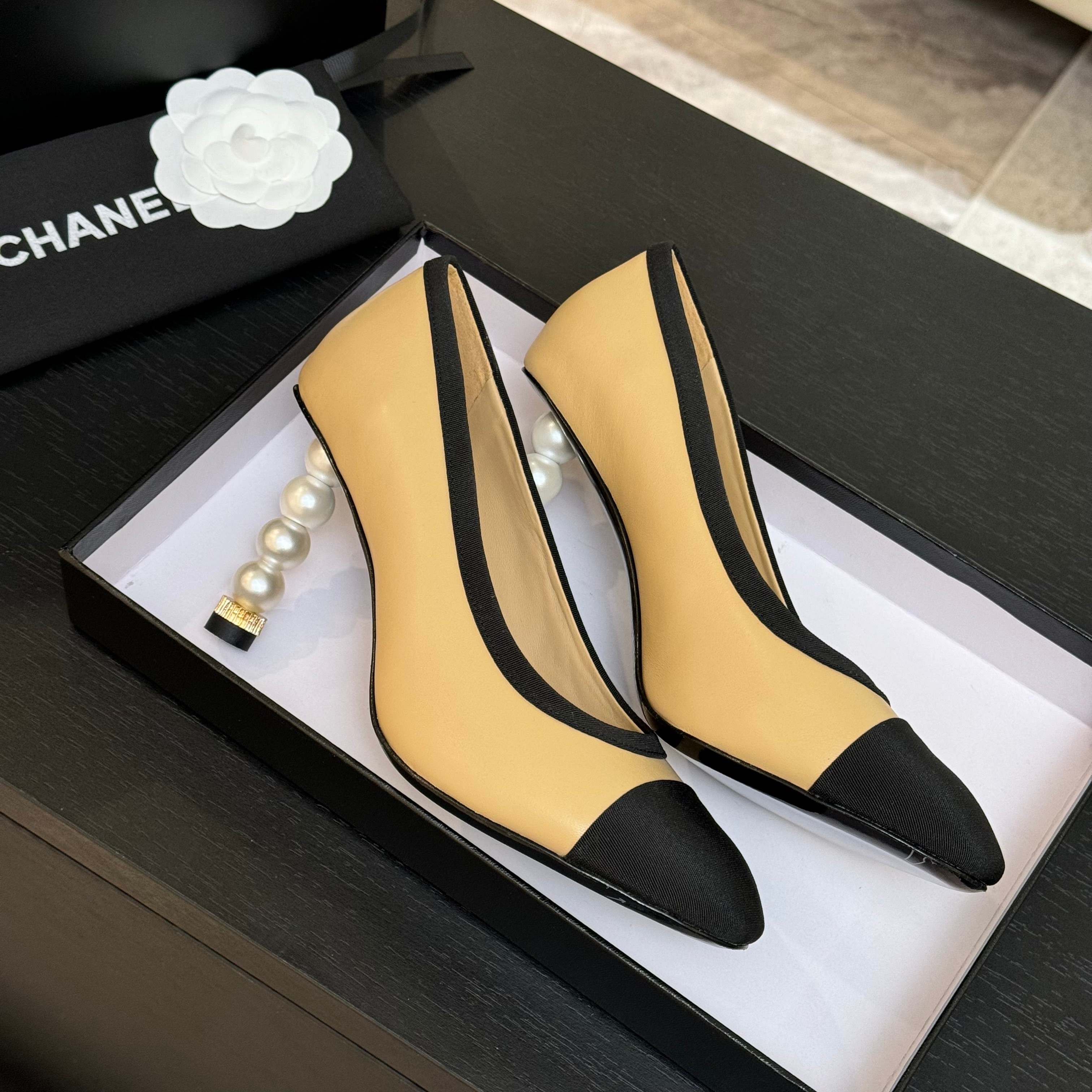 Chanel Women's Beige & Black Leather Pointed Toe Pearl Heel Pumps 1 Chanel Women's Beige & Black Leather Pointed Toe Pearl Heel Pumps