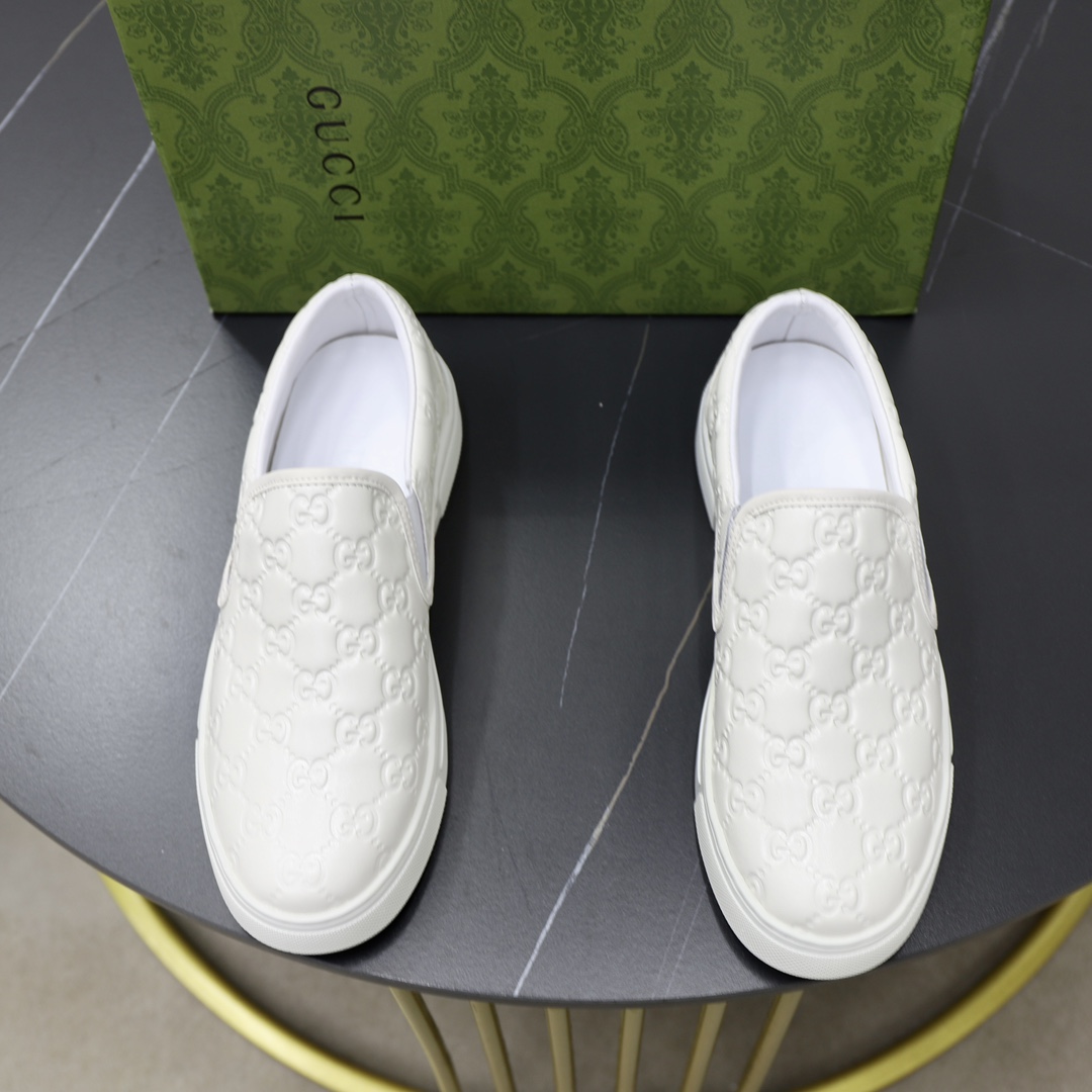 Gucci Men's White Leather Slip-On Sneakers with Embossed GG Pattern