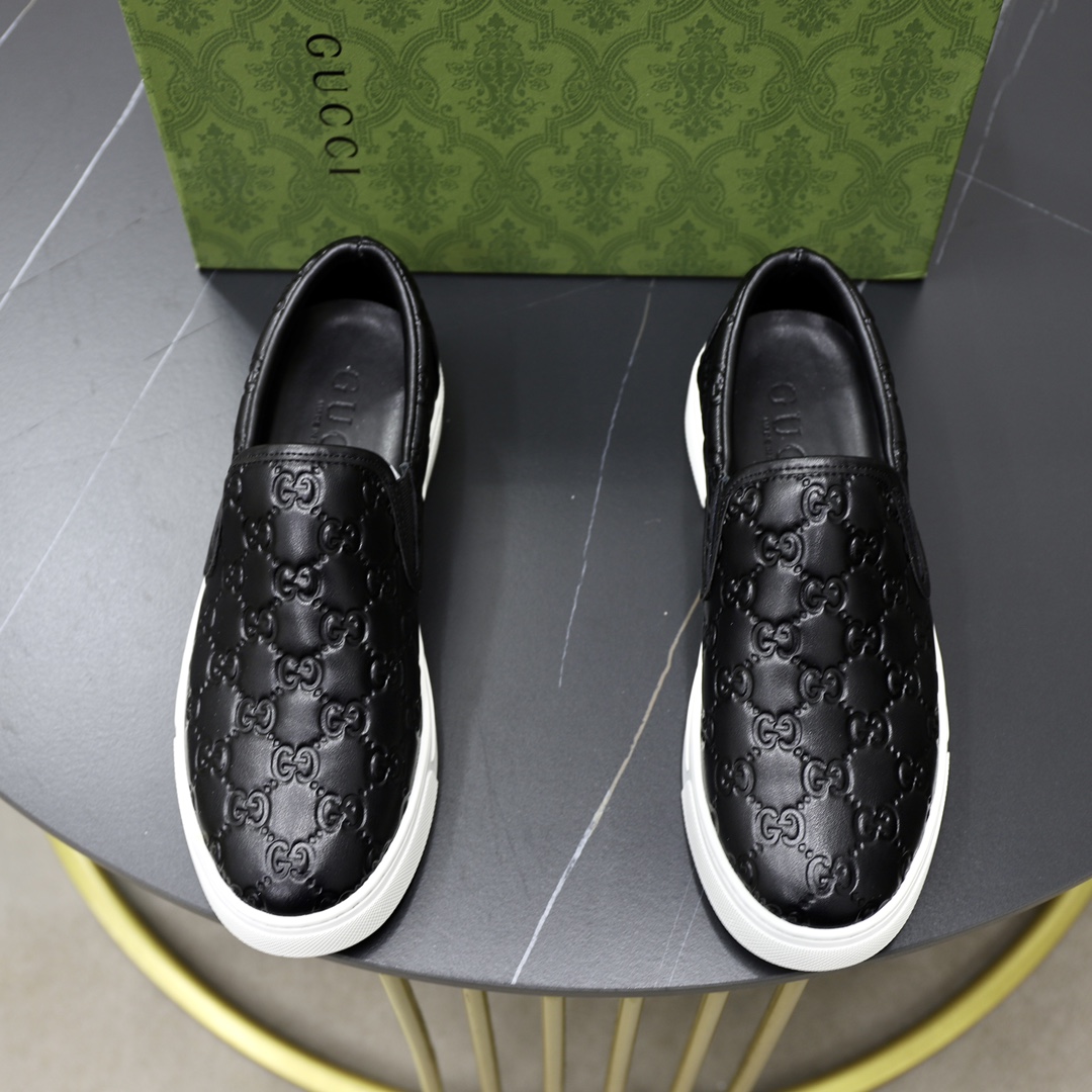 Gucci Men's Black Leather Slip-On Sneakers with GG Embossed Pattern
