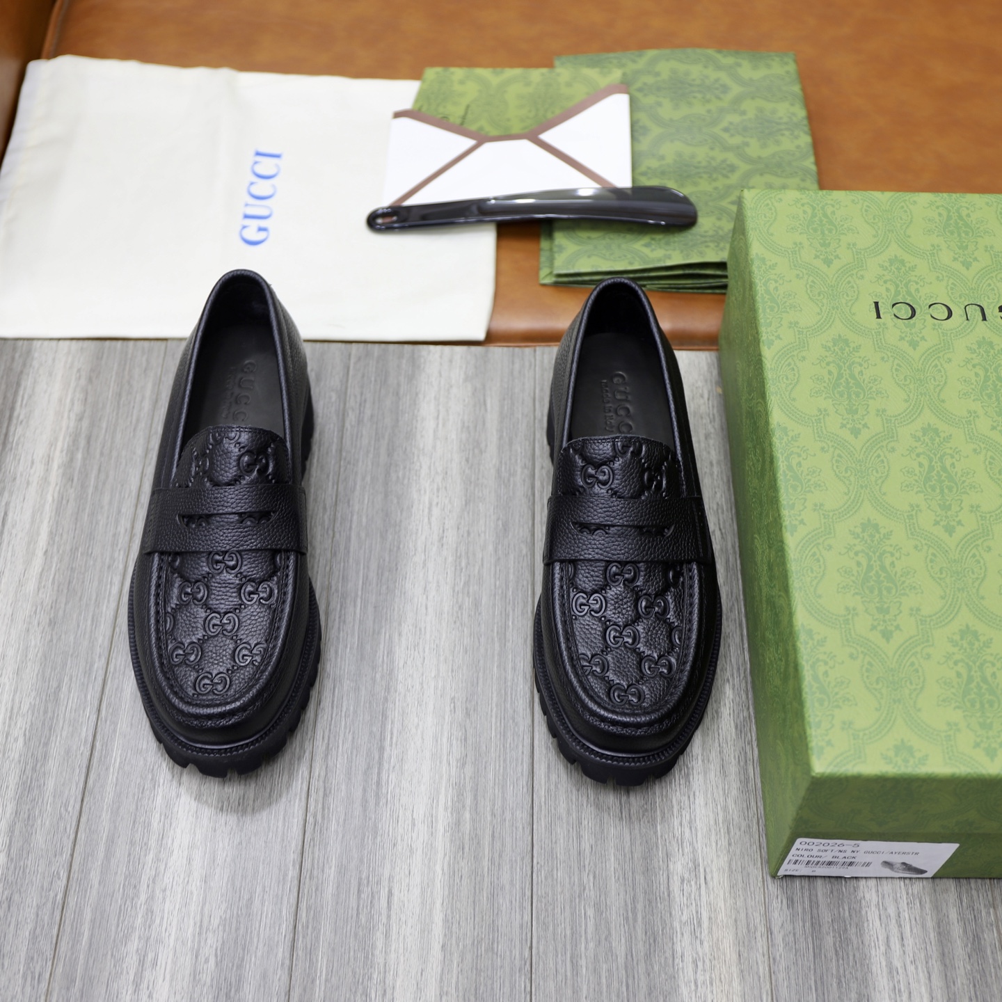 Gucci Men's Black Leather Loafers with Chain G Buckle and GG Embossed Design 1 Gucci Men's Black Leather Loafers with Chain G Buckle and GG Embossed Design