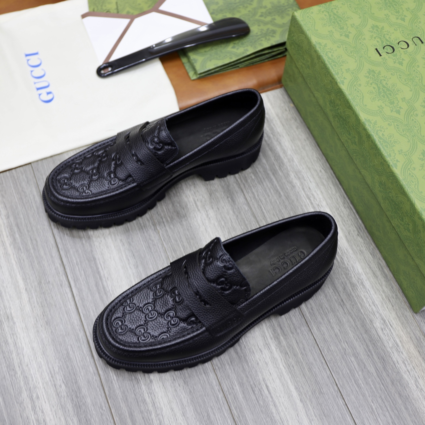 Gucci Men's Black Leather Loafers with Chain G Buckle and GG Embossed Design 4 i1742574774602 4008 0 2