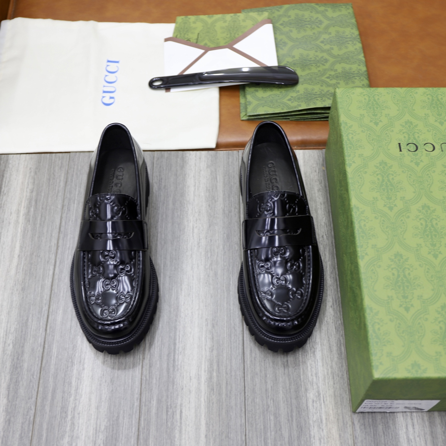 Gucci Men's Black Leather Loafers with Chain G Buckle Detail and Embossed GG Motif 2 i1742574815680 9032 0 0