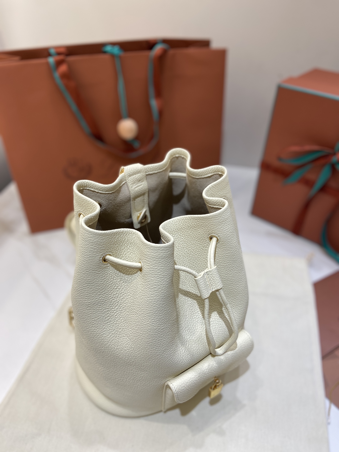 Loro Piana Extra Drawstring Backpack in White Leather with Padlock Charm 4 i1749266776061 1683 0 2