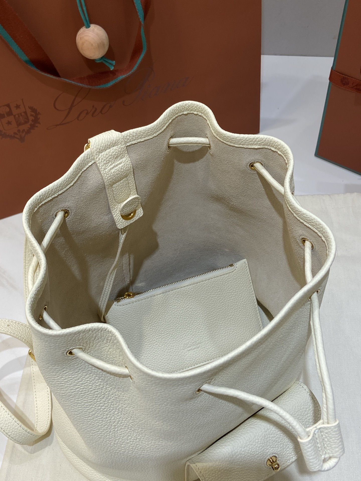Loro Piana Extra Drawstring Backpack in White Leather with Padlock Charm 7 i1749266776080 3373 0 5