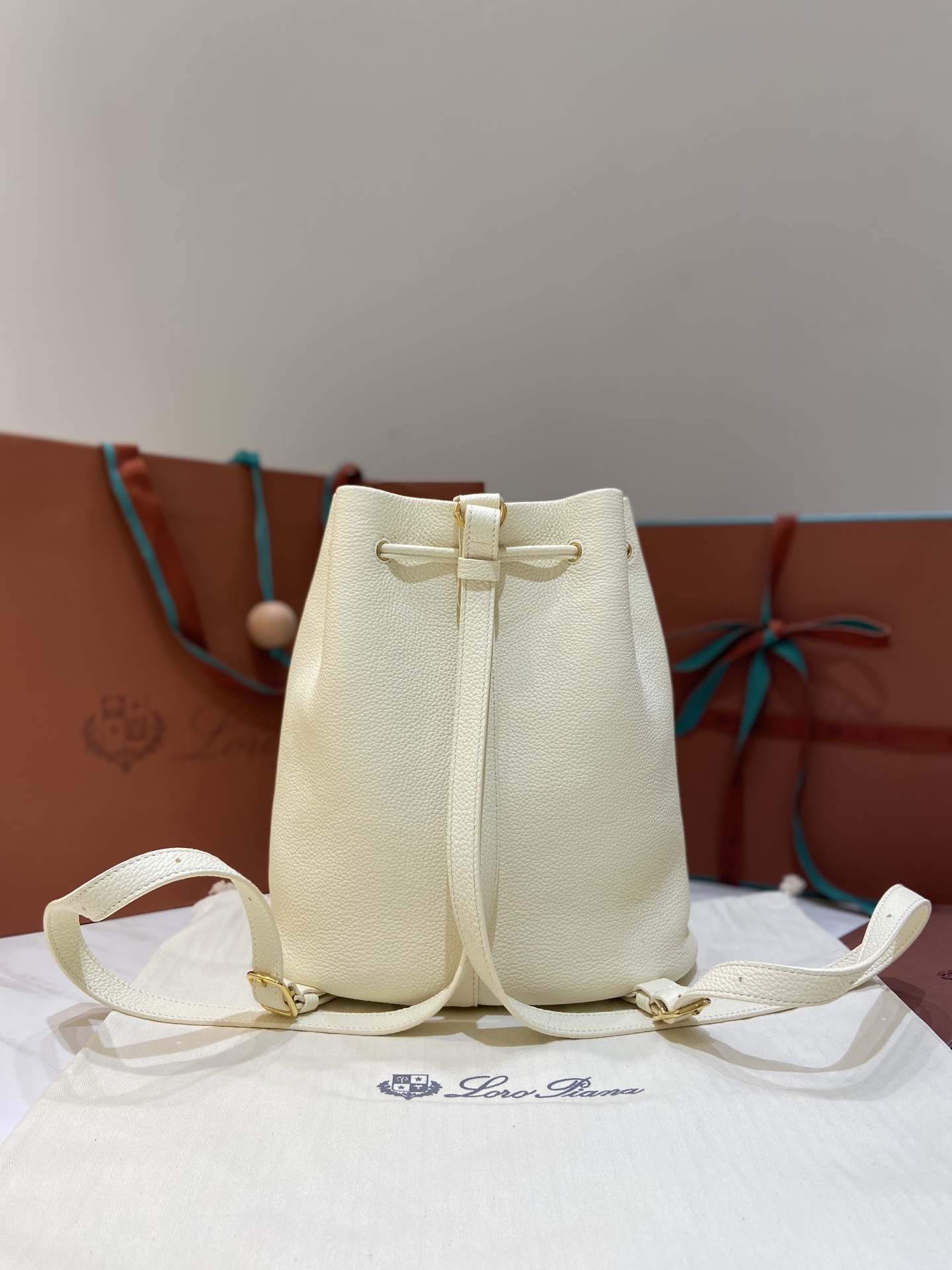 Loro Piana Extra Drawstring Backpack in White Leather with Padlock Charm 3 i1749266783167 3736 0 1