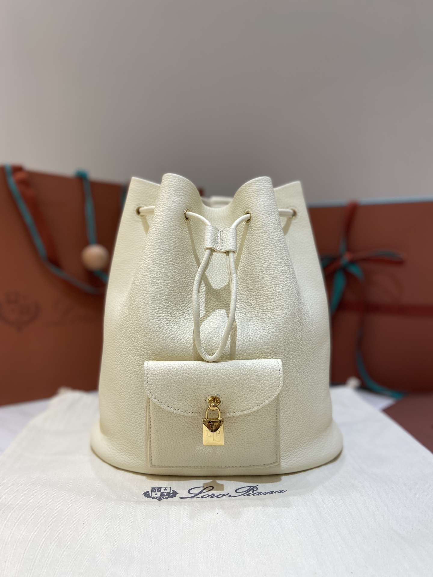 Loro Piana Extra Drawstring Backpack in White Leather with Padlock Charm 2 i1749266783175 3048 0 0