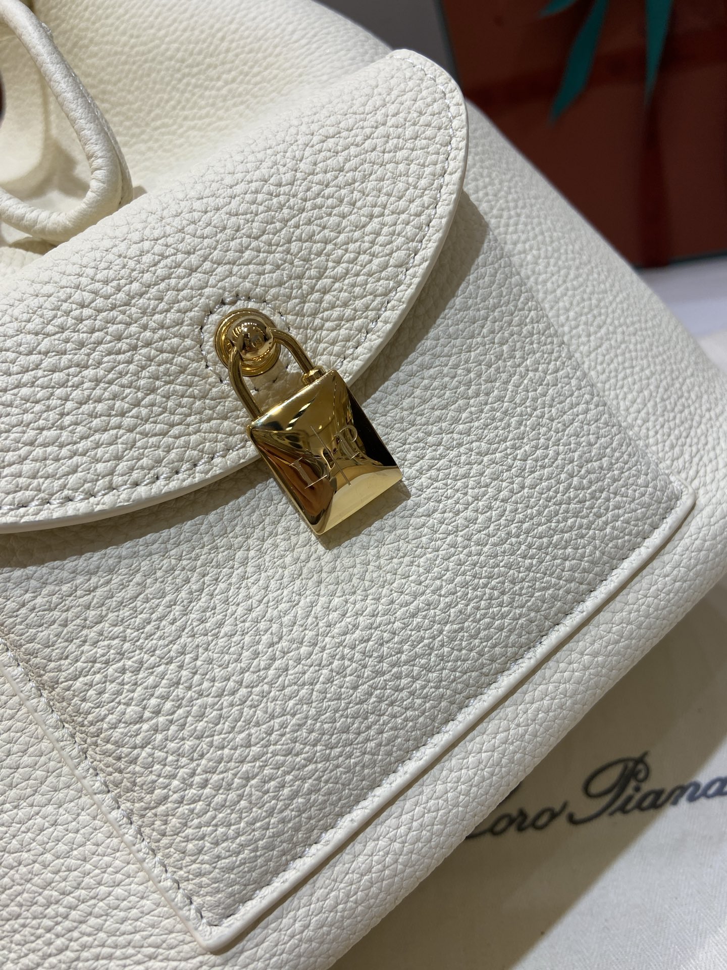Loro Piana Extra Drawstring Backpack in White Leather with Padlock Charm 6 i1749266783215 5008 0 4