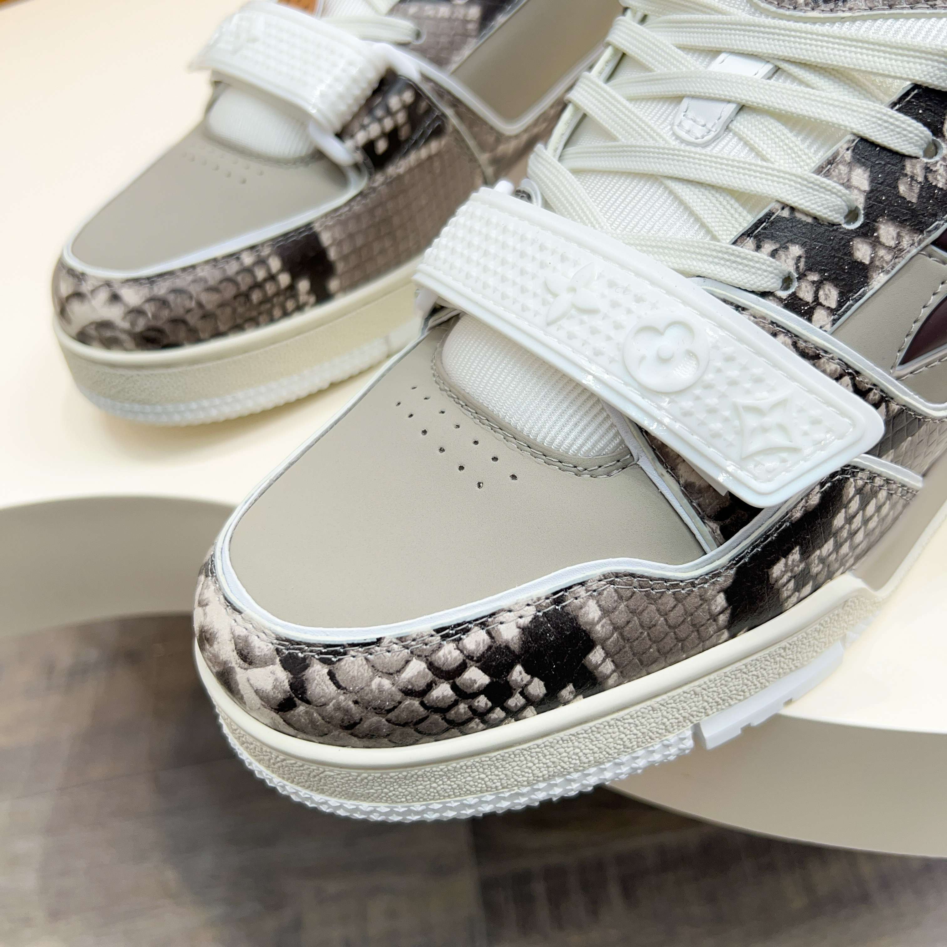 Louis Vuitton Trainer Sneaker in Monogram Embossed Leather 4 a1743229953317 1564