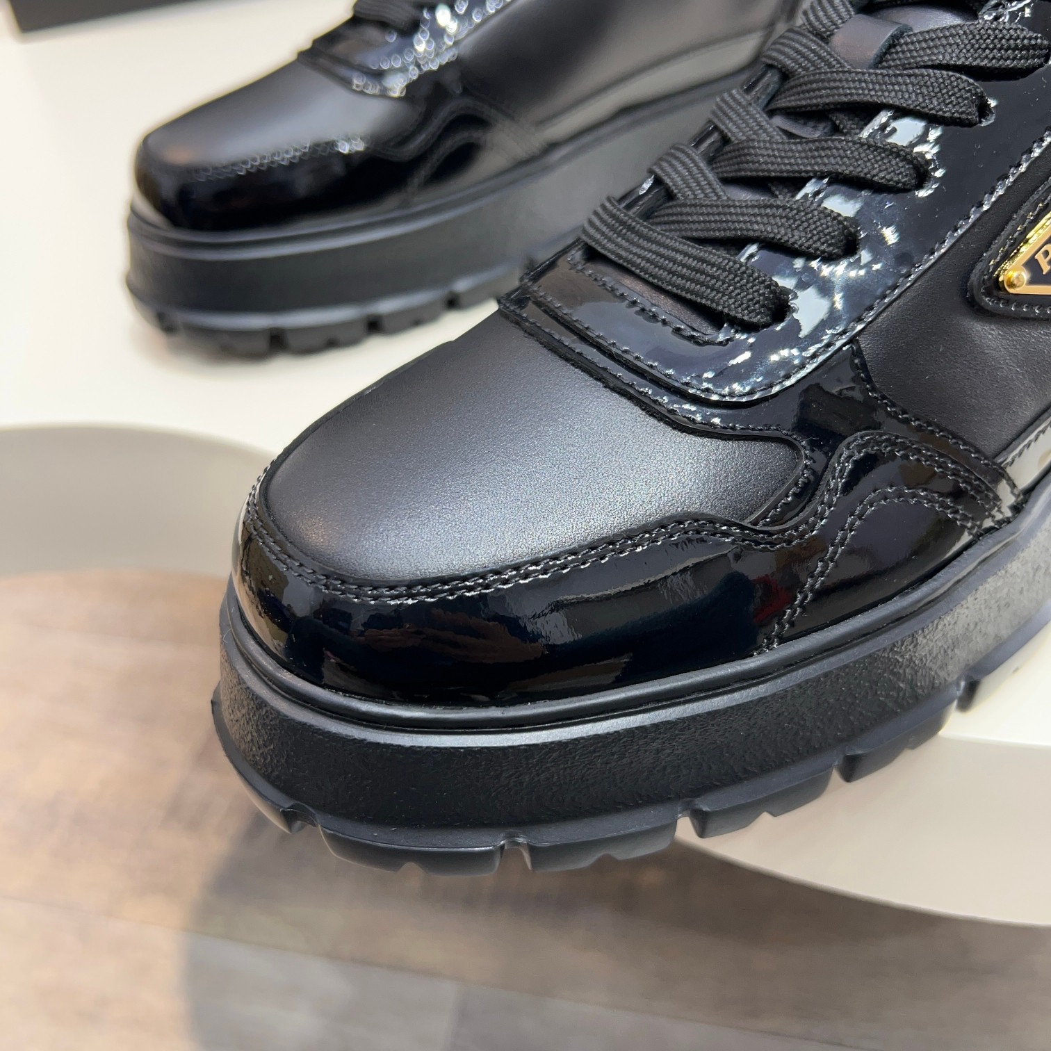 Prada Men's Black Leather and Patent Leather Lace-Up Sneakers 8 a1744085617000 3721
