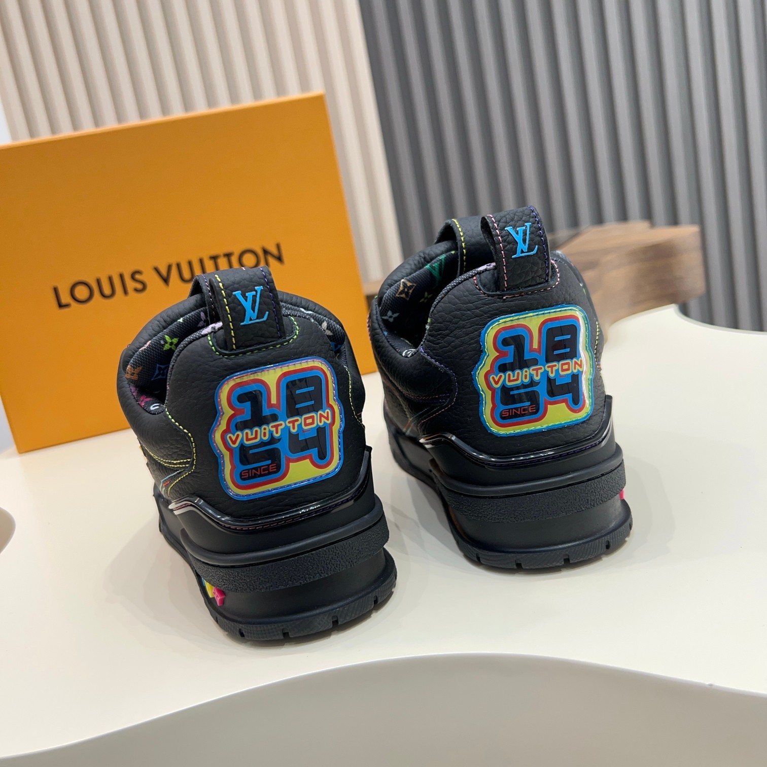 Louis Vuitton Trainer Sneakers in Black Leather with Monogram Detailing 4 a1744496829297 8086