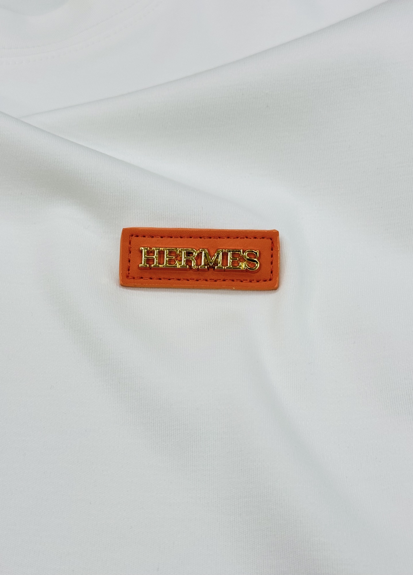 HERMES爱马仕爆款推荐！莫代尔棉短袖T恤.胸口3D立体图形皮标绣花.经典橘色.层次立体感极强！视觉冲