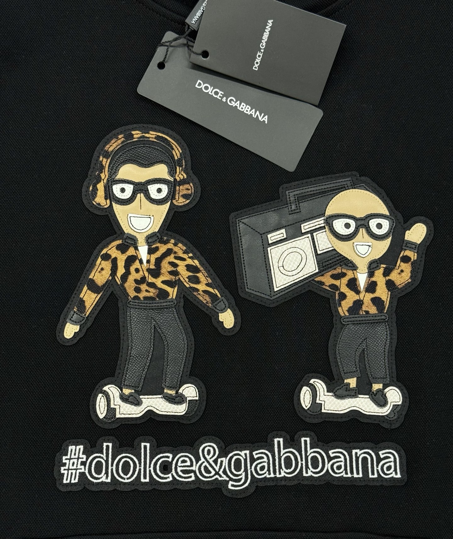 Dolce & Gabbana卡通卫衣.男女同款！这款Dolce & Gabbana卡通印花连帽卫衣，黑