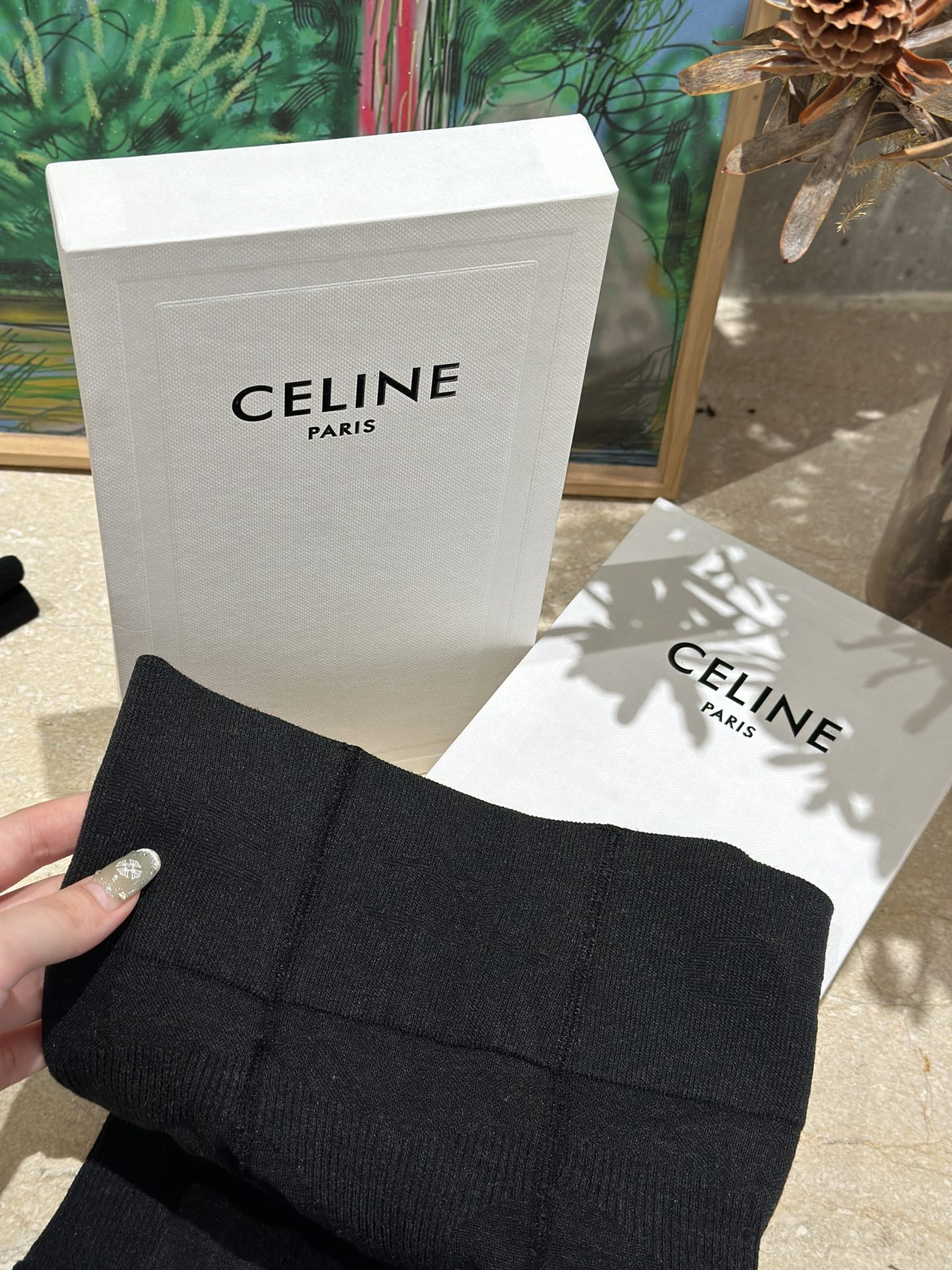 featuring the signature Triomphe emblem alongside the Celine knit motif - Comprehensive
