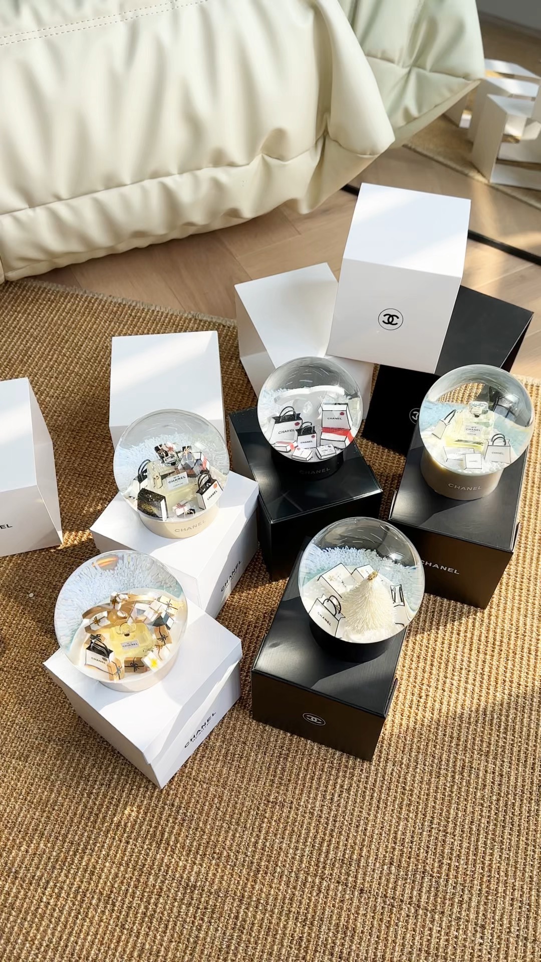 A collectible Chanel snow globe featuring a drifting interior snowfall - Comprehensive