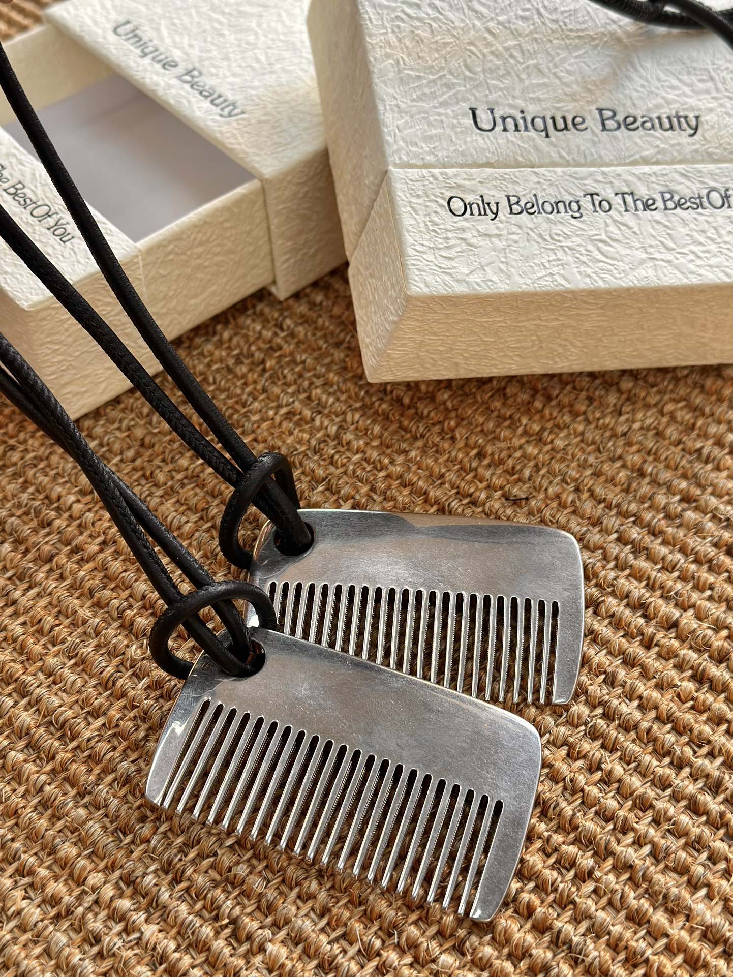 this comb serves as both a functional styling accessory and a bag charm - Comprehensive 3