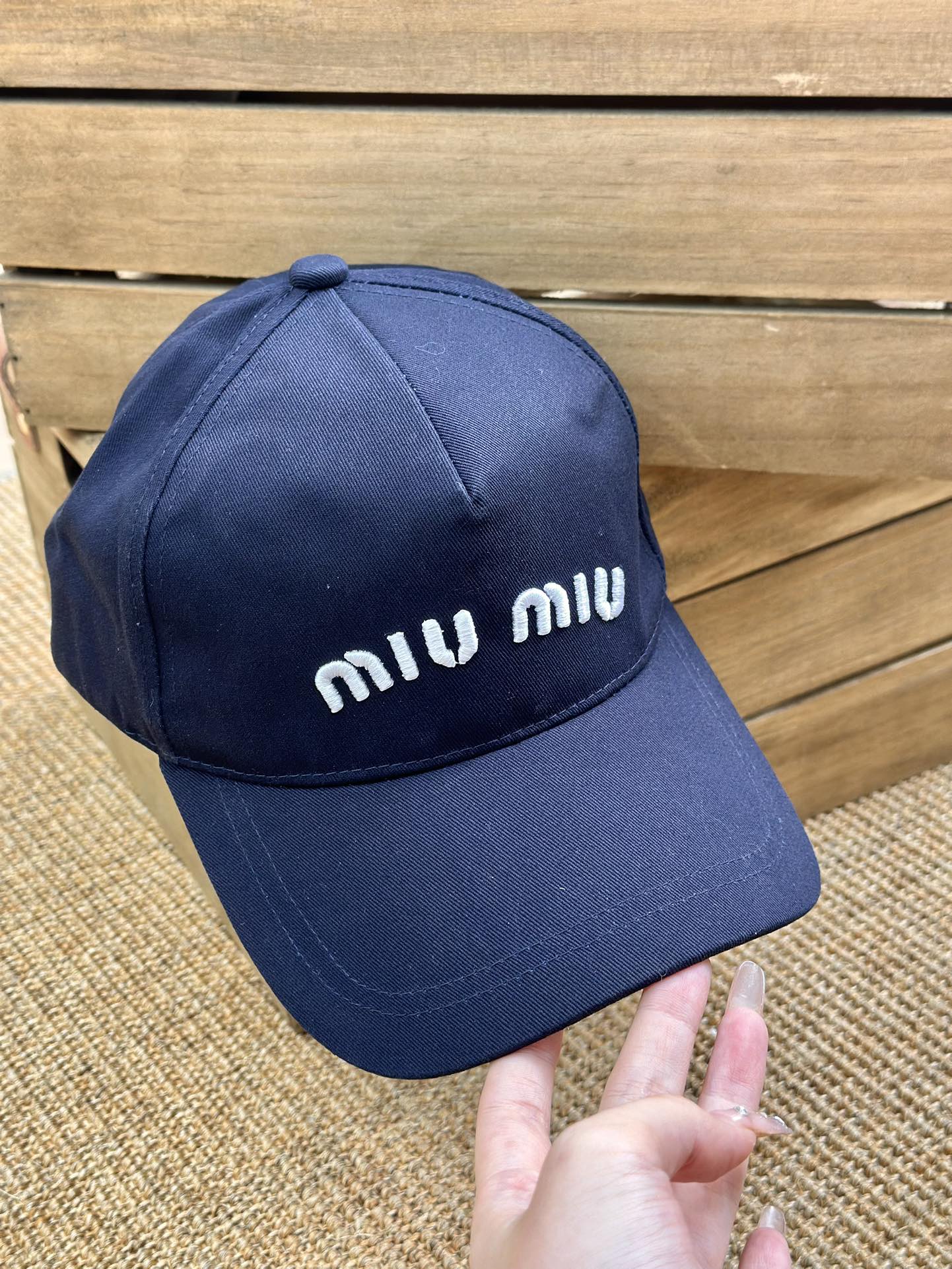 detailed with signature Miu Miu embroidery across the front and a - Comprehensive 2
