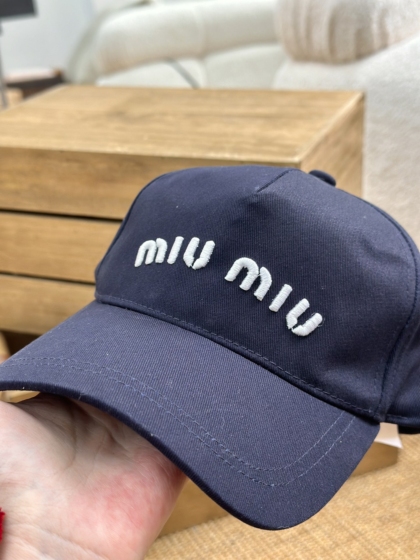 detailed with signature Miu Miu embroidery across the front and a - Comprehensive 3