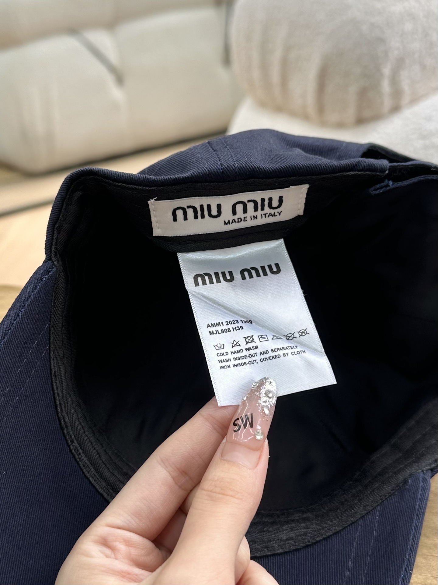 detailed with signature Miu Miu embroidery across the front and a - Comprehensive 6