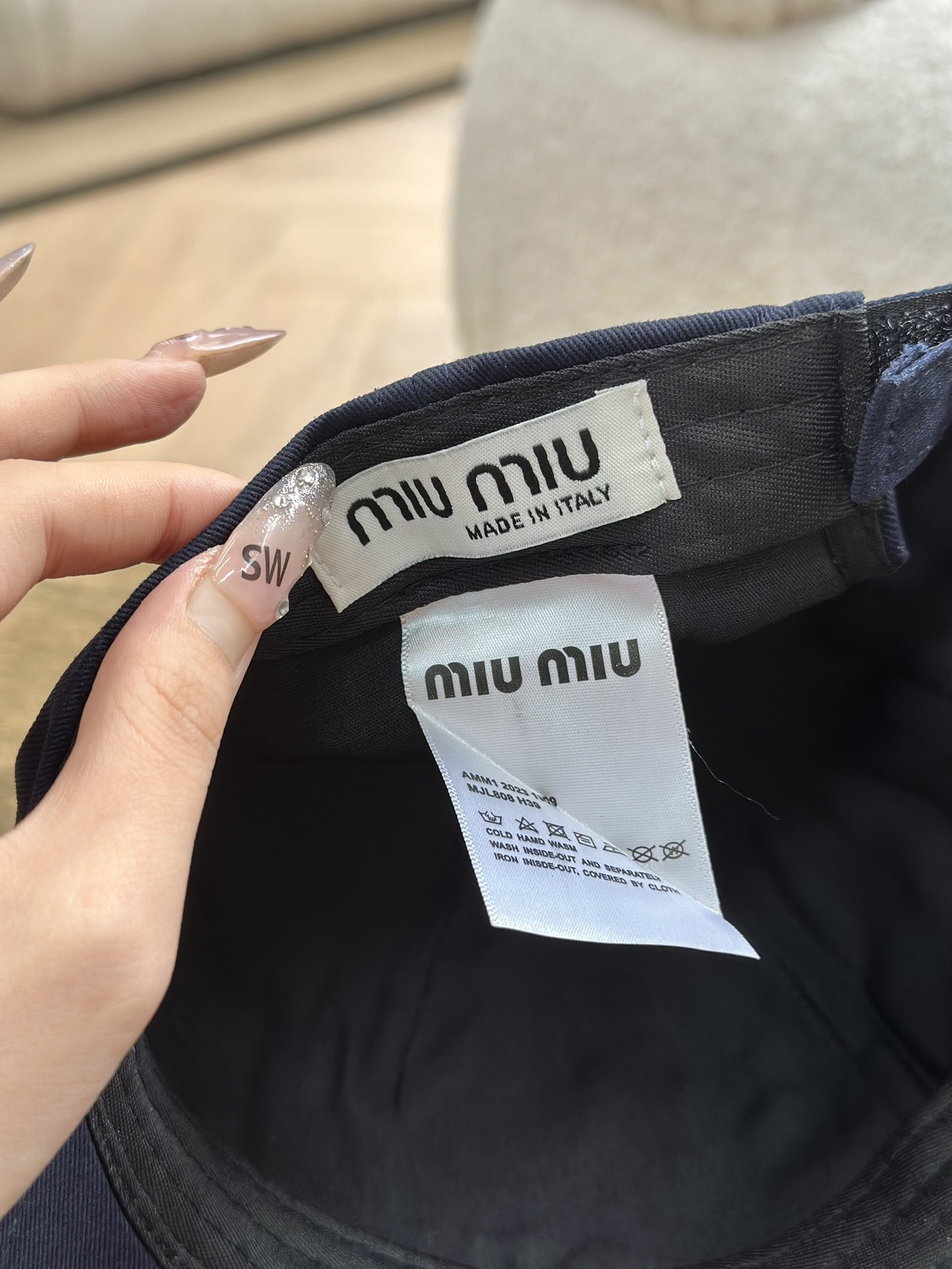 detailed with signature Miu Miu embroidery across the front and a - Comprehensive 5
