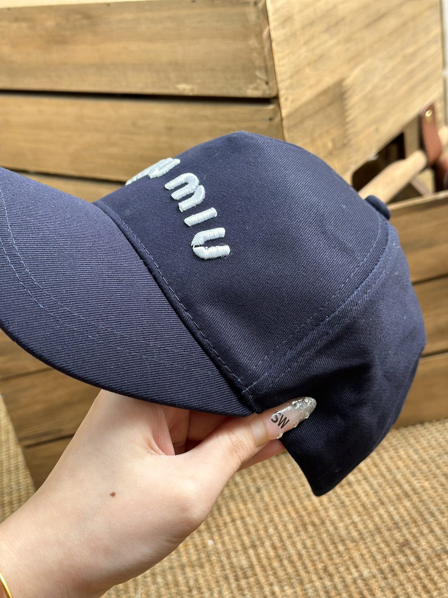 detailed with signature Miu Miu embroidery across the front and a - Comprehensive 8