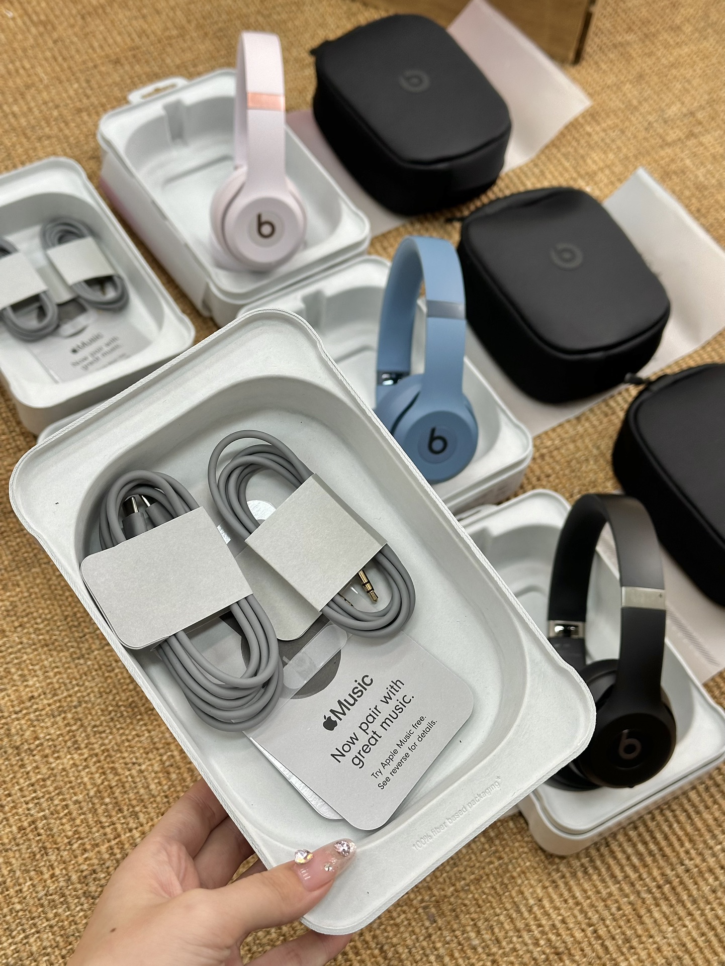 the headphones include a black carrying pouch, a charging cable, an - Comprehensive 9