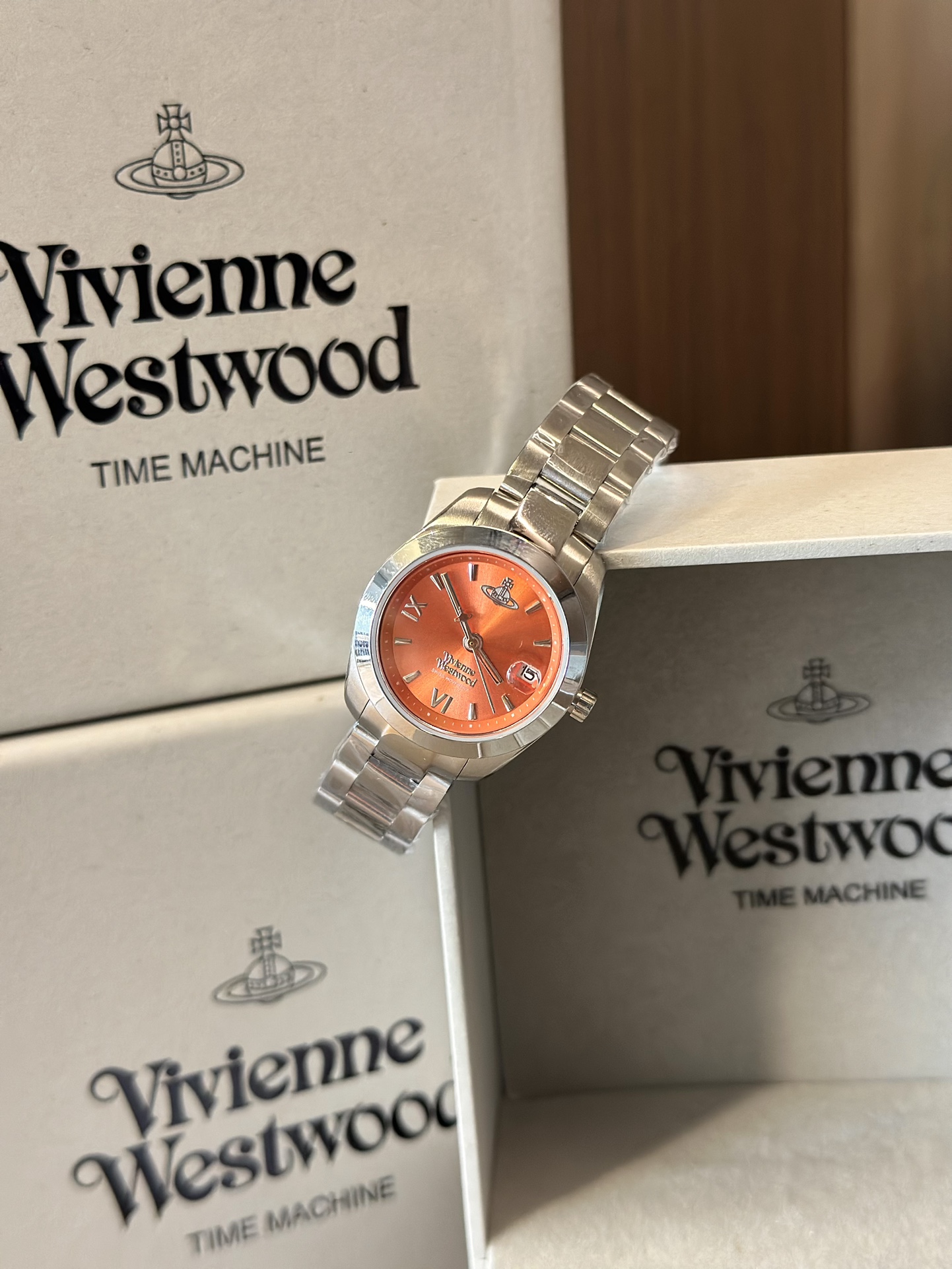 Distinguished by a bold orange dial paired with a silver-tone bracelet - Jewelry 8
